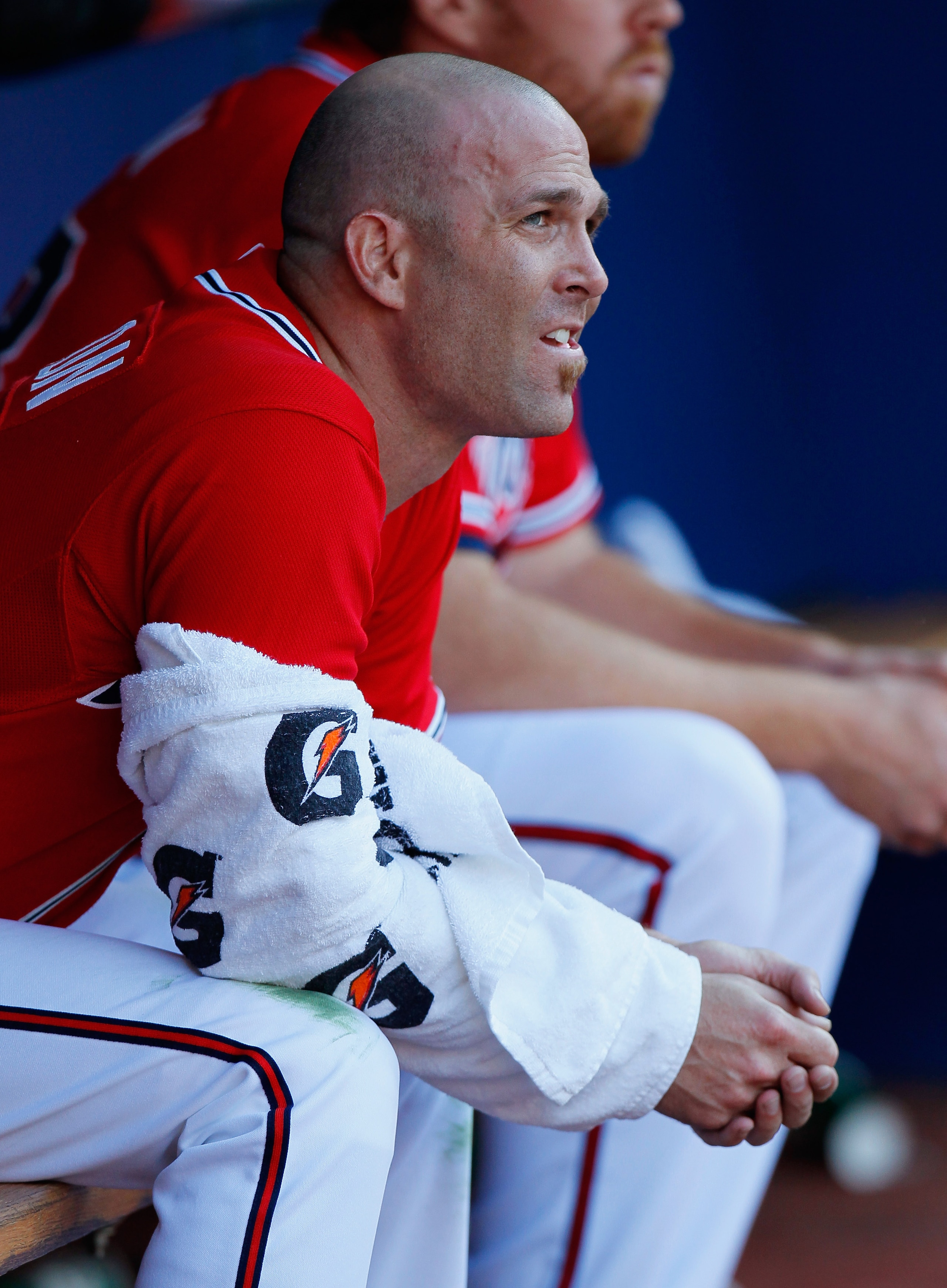 ATLANTA - OCTOBER 10:  Starting pitcher Tim Hudson #15 of the Atlanta Braves sits in the dugout between innings against the San Francisco Giants during Game Three of the NLDS of the 2010 MLB Playoffs at Turner Field on October 10, 2010 in Atlanta, Georgia
