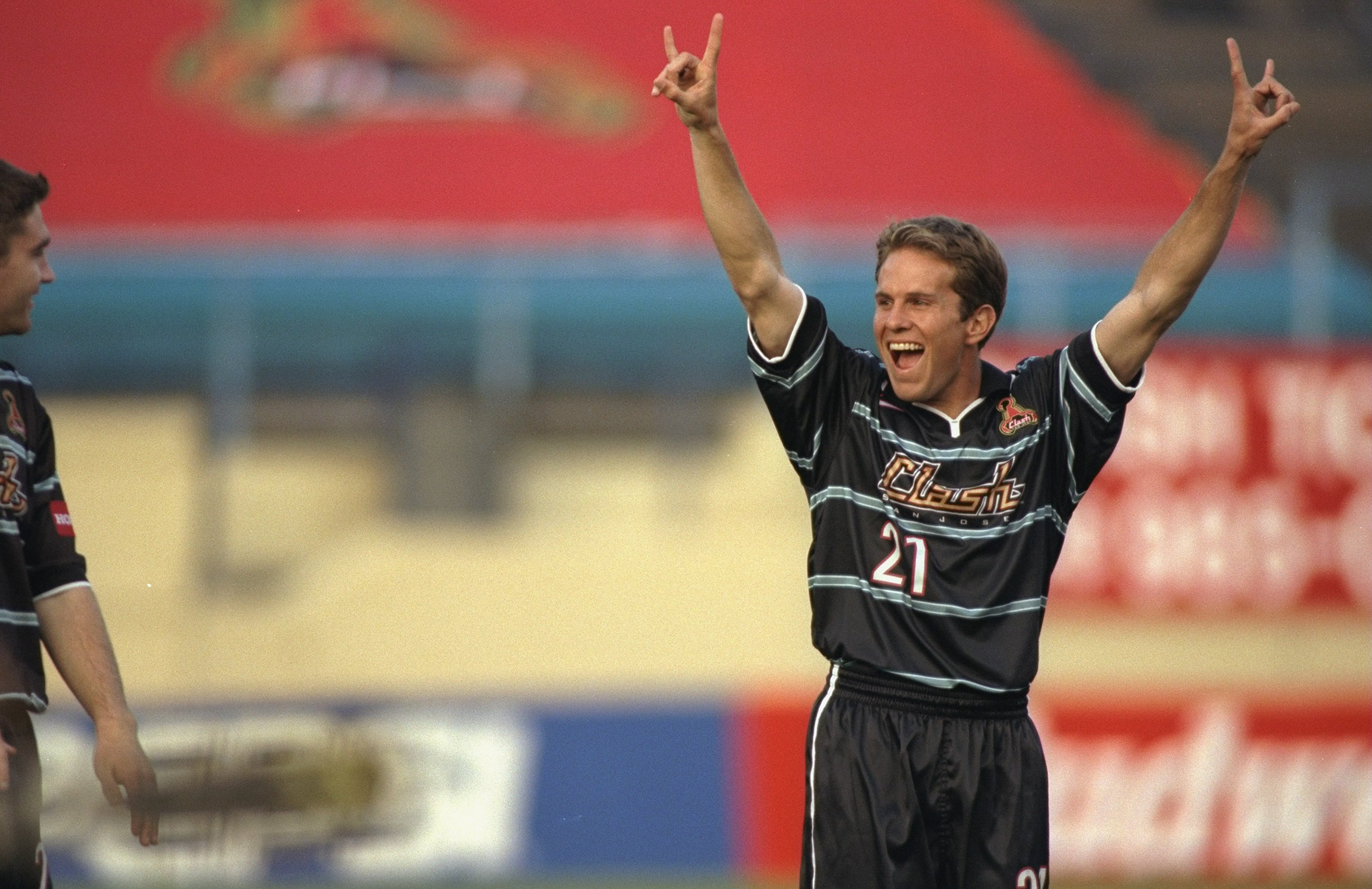 30 Apr 1999:  Eddie Lewis #21 of the San Jose Clash celebrates during the game against the Dallas Burn at the Spartan Stadium in San Jose, California. The Clash defeated the Burn 2-1. Mandatory Credit: Jed Jacobsohn  /Allsport