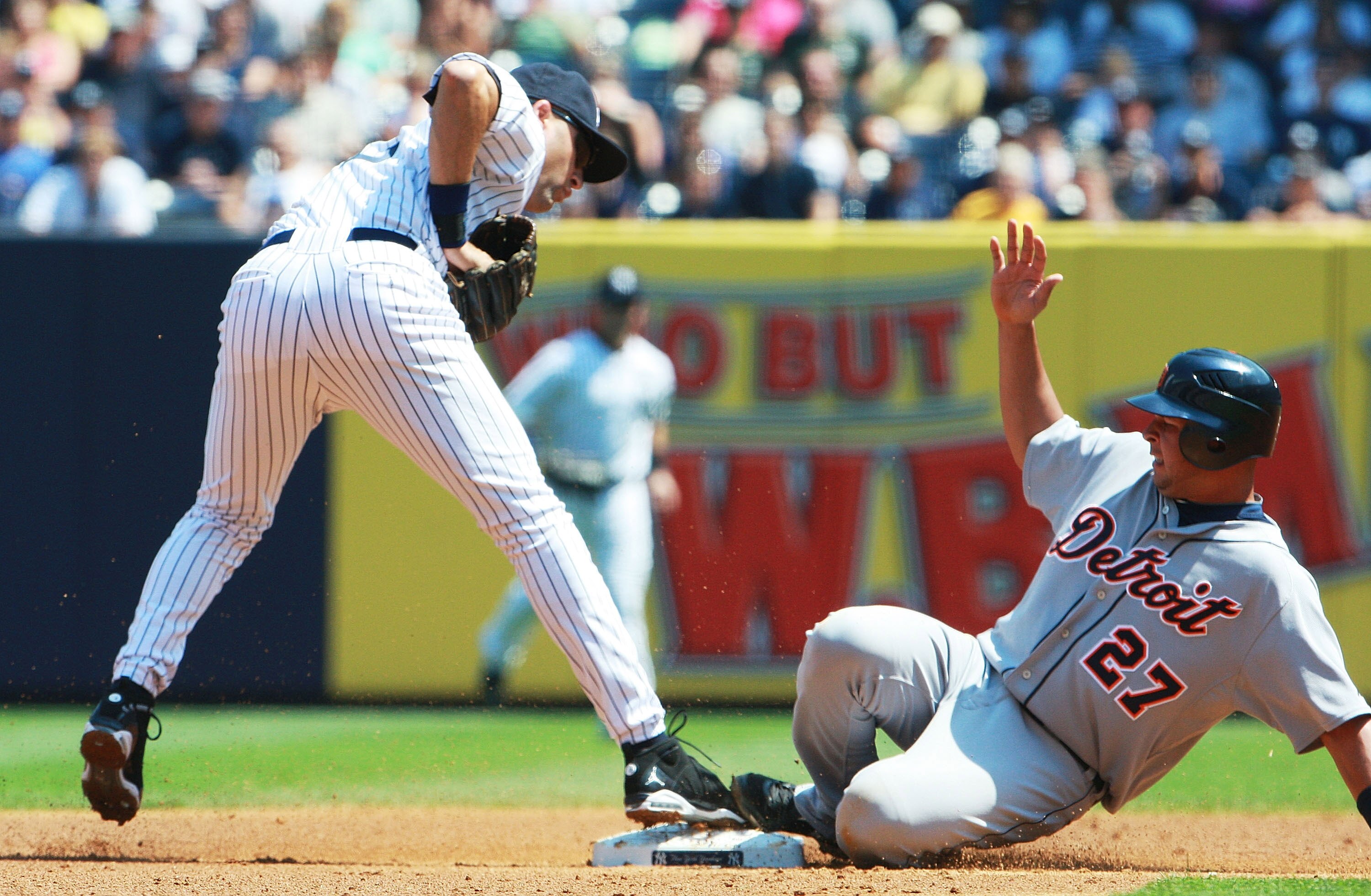 NEW YORK - AUGUST 19: Jhonny Peralta #27 of the Detroit Tigers slides safely into second base against Derek Jeter #2 of the New York Yankees in the second inning at Yankee Stadium on August 19, 2010 in the Bronx borough of New York City.  (Photo by Andrew