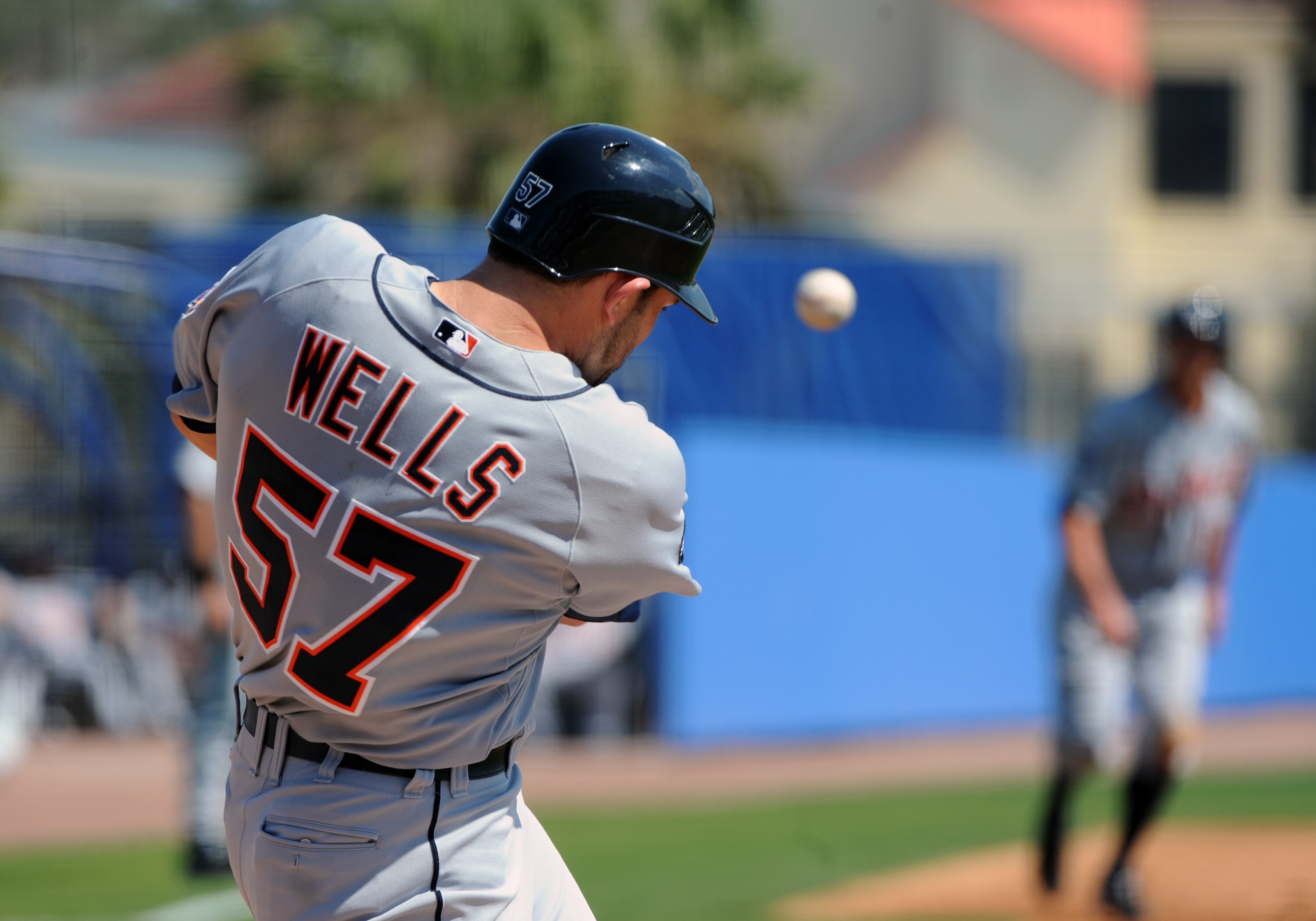 DUNEDIN, FL - FEBRUARY 26:  Outfielder Casper Wells #57 of the Detroit Tigers pulls a foul ball down the third base line against the Toronto Blue Jays February 26, 2011 at Florida Auto Exchange Stadium in Dunedin, Florida.  (Photo by Al Messerschmidt/Gett