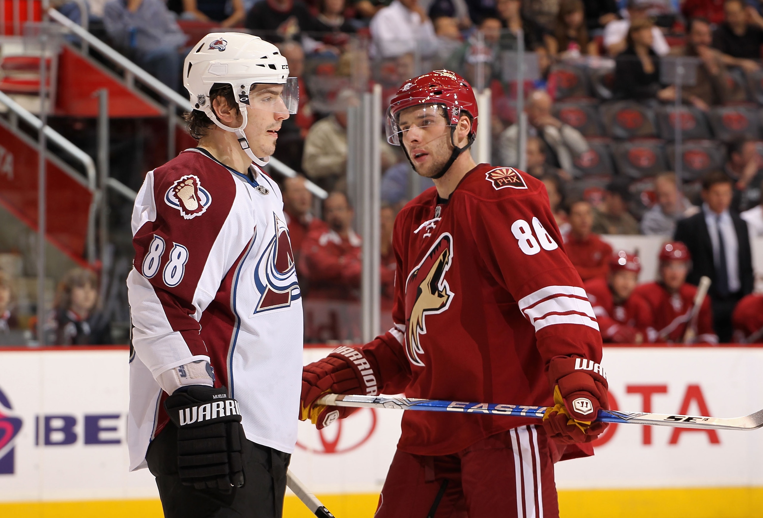 GLENDALE, AZ - MARCH 04:  Peter Mueller #88 of the Colorado Avalanche and Wojtek Wolski #86 of the Phoenix Coyotes await a face off during the first period of the NHL game at Jobing.com Arena on March 4, 2010 in Glendale, Arizona.  (Photo by Christian Pet