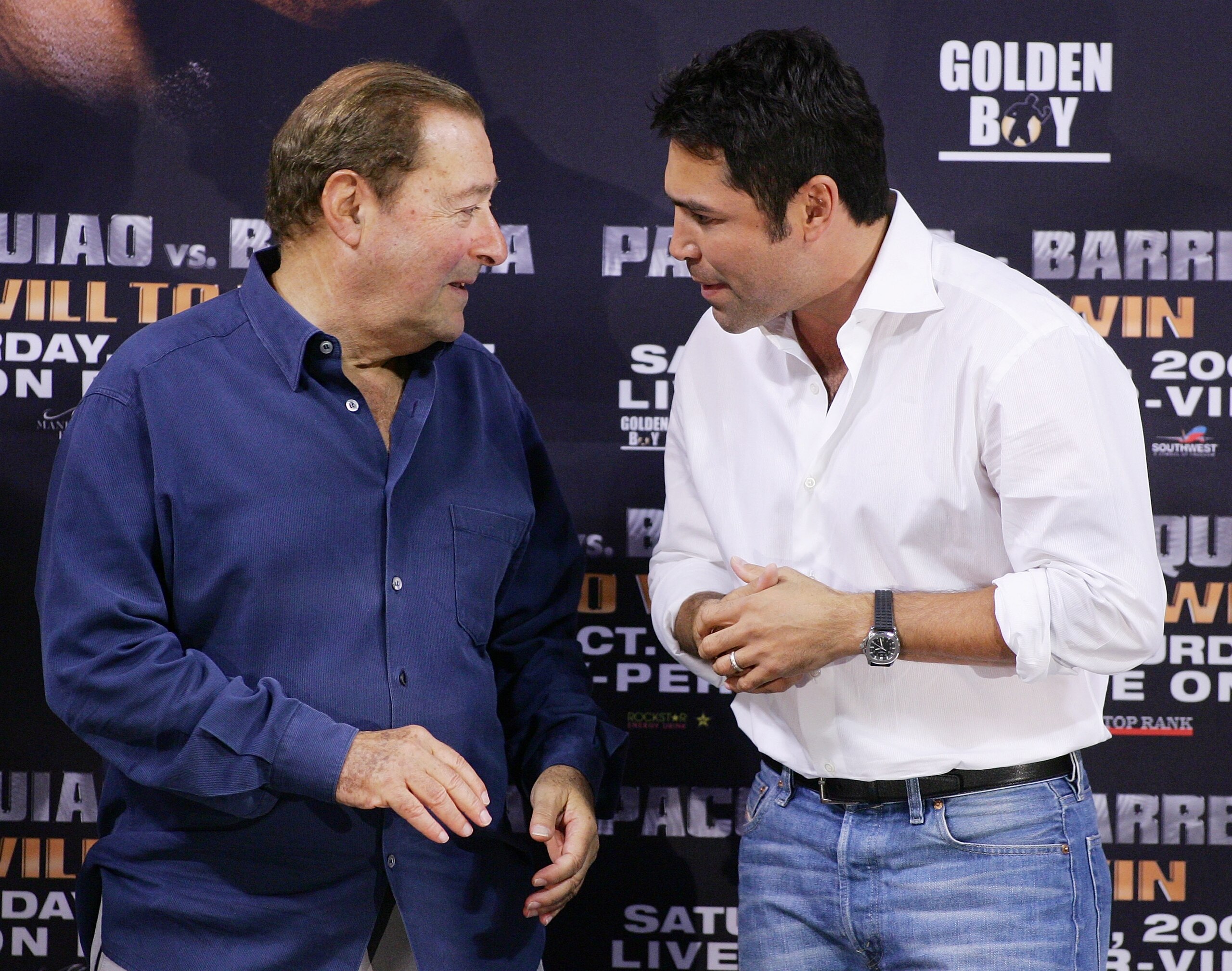 LAS VEGAS - OCTOBER 05:  Boxing promoter Bob Arum (L) and boxer and president of Golden Boy Promotions Oscar De La Hoya speak at the official weigh-in for boxers Manny Pacquiao and Marco Antonio Barrera at the Mandalay Bay Events Center October 5, 2007 in