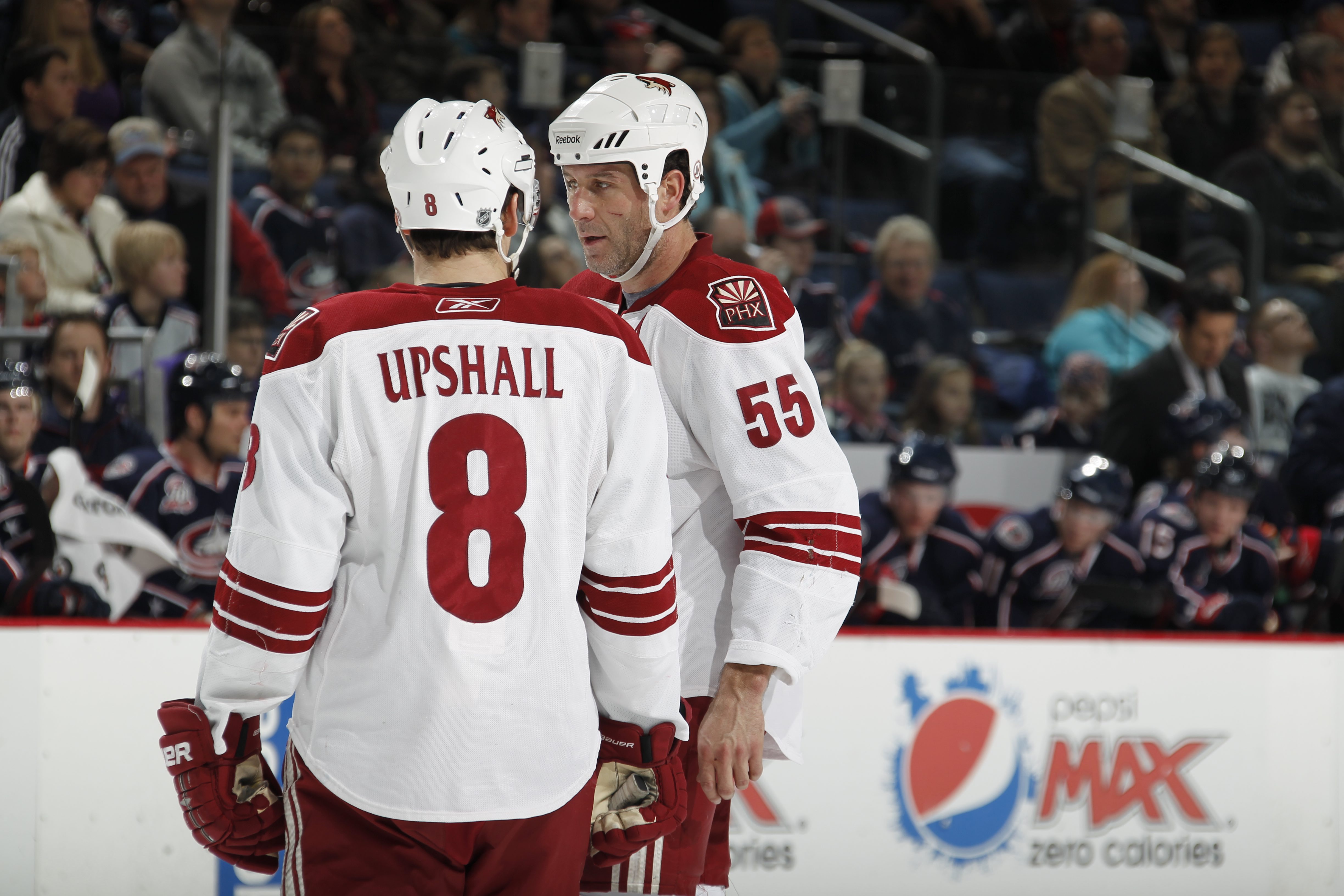 COLUMBUS, OH - JANUARY 11: Scottie Upshall #8 of the Phoenix Coyotes talks with teammate Ed Jovanovski #55 during a game against the Colubus Blue Jackets on January 11, 2011 at the Nationwide Arena in Columbus, Ohio. (Photo by Gregory Shamus/Getty Images)