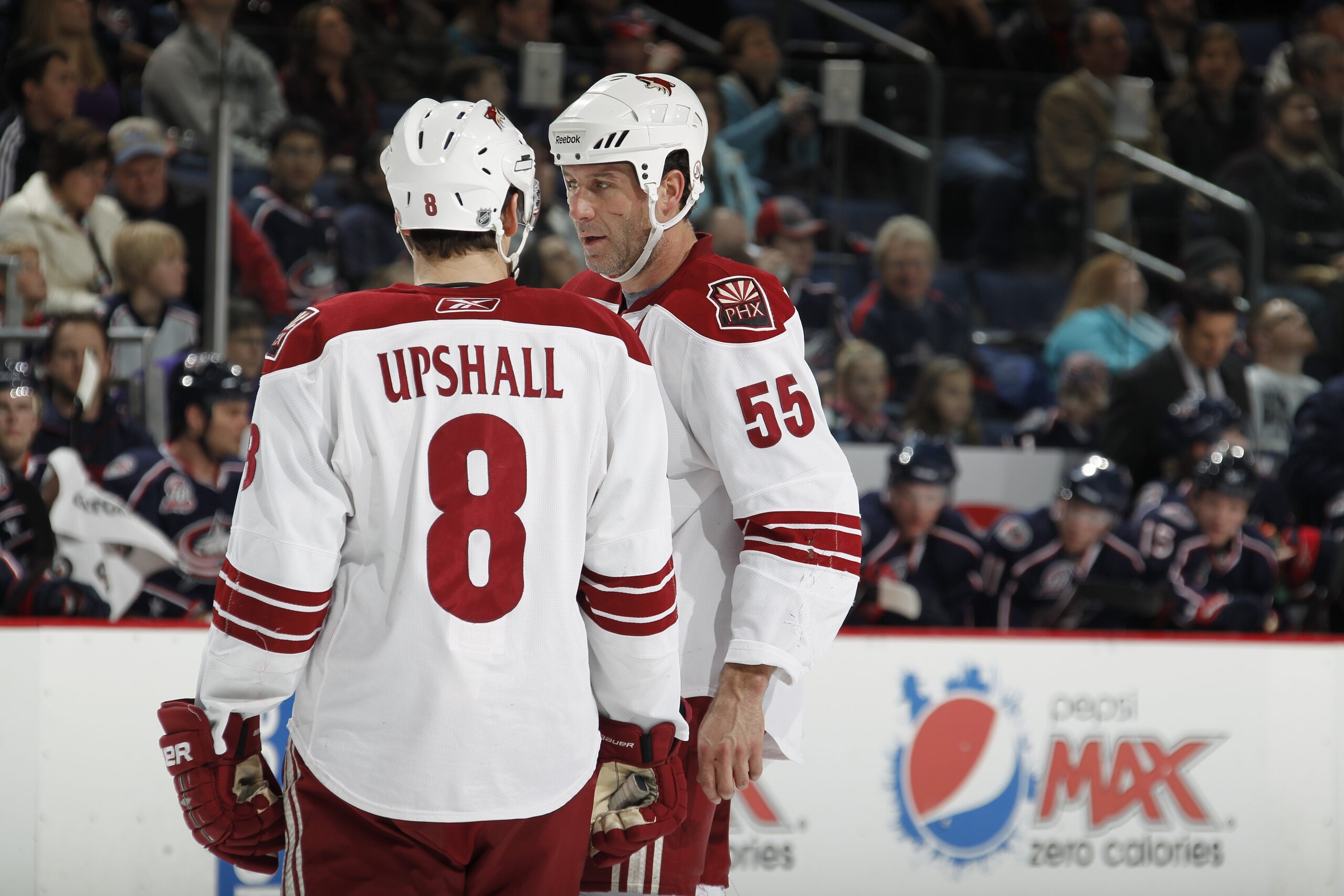 COLUMBUS, OH - JANUARY 11: Scottie Upshall #8 of the Phoenix Coyotes talks with teammate Ed Jovanovski #55 during a game against the Colubus Blue Jackets on January 11, 2011 at the Nationwide Arena in Columbus, Ohio. (Photo by Gregory Shamus/Getty Images)