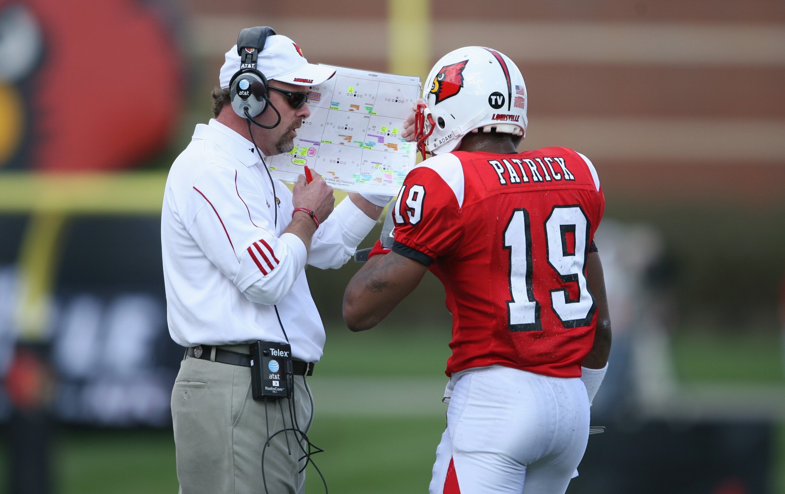 LOUISVILLE, KY - OCTOBER 18: Head Coach Steve Kragthorpe of the Louisville Cardinals discusses play with Johnny Patrick #19 during the game against the Middle Tennessee Blue Raiders at Papa John's Cardinal Stadium on October 18, 2008 in Louisville, Kentu LOUISVILLE, KY - OCTOBER 18: Head Coach Steve Kragthorpe of the Louisville Cardinals discusses play with Johnny Patrick #19 during the game against the Middle Tennessee Blue Raiders at Papa John's Cardinal Stadium on October 18, 2008 in Louisville, Kentu