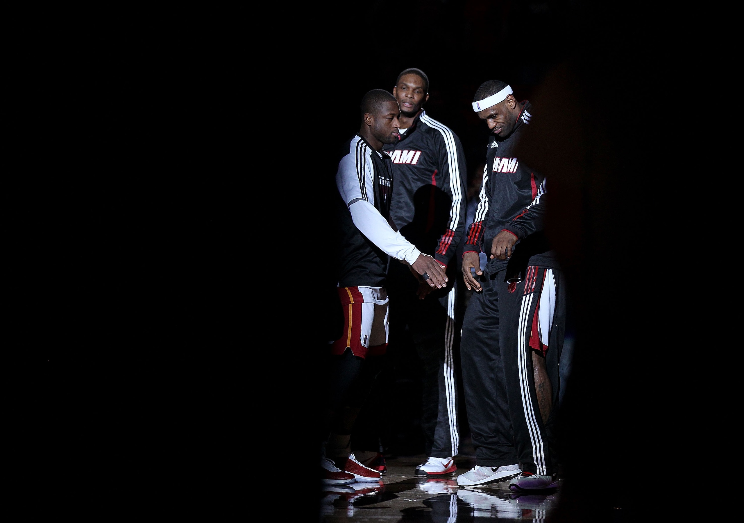 MIAMI, FL - FEBRUARY 25: LeBron James #6, Dwyane Wade #3 and Chris Bosh #1 of the Miami Heat talk during a game against the Washington Wizards at American Airlines Arena on February 25, 2011 in Miami, Florida. NOTE TO USER: User expressly acknowledges an MIAMI, FL - FEBRUARY 25: LeBron James #6, Dwyane Wade #3 and Chris Bosh #1 of the Miami Heat talk during a game against the Washington Wizards at American Airlines Arena on February 25, 2011 in Miami, Florida. NOTE TO USER: User expressly acknowledges an