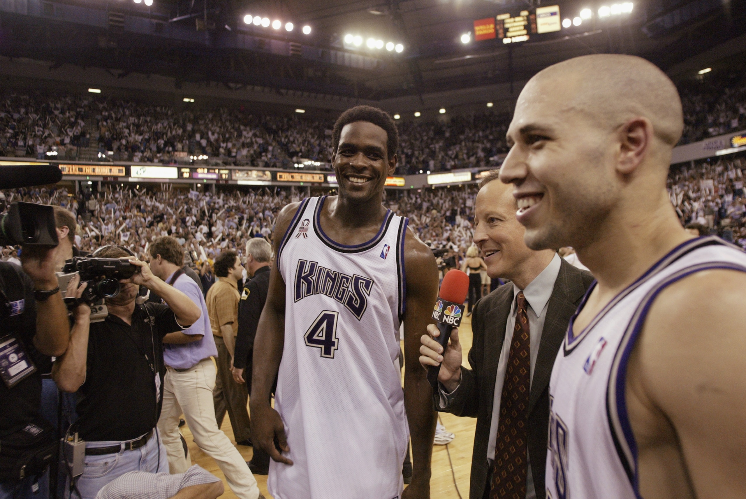 SACRAMENTO, CA - MAY 28:  Broadcaster Jim Gray of NBC interviews point guard Mike Bibby #10 and forward Chris Webber #4 of the Sacramento Kings after the Kings won Game five of the Western Conference Finals against the Los Angeles Lakers during the 2002 N