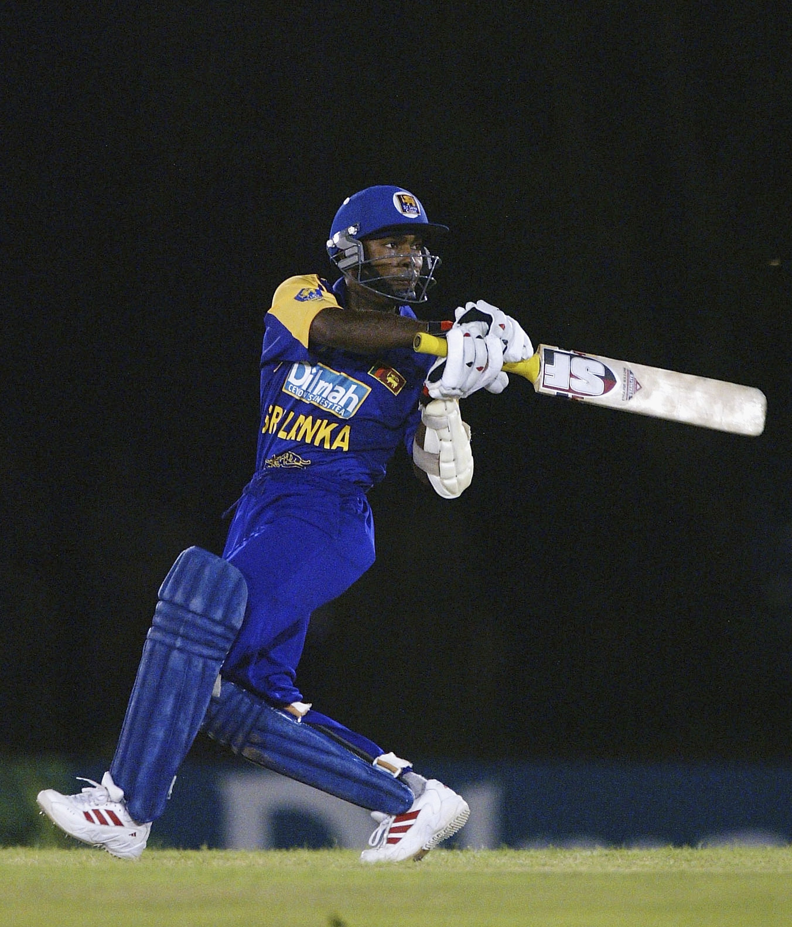 DAMBULLA, SRI LANKA - NOVEMBER 18:  Romesh Kaluwitharana of Sri Lanka hits out on the way to victory during the Sri Lanka v England first One Day International match at the Rangiri Dambulla Stadium, on November 18, 2003, in Dambulla, Sri Lanka. (Photo by