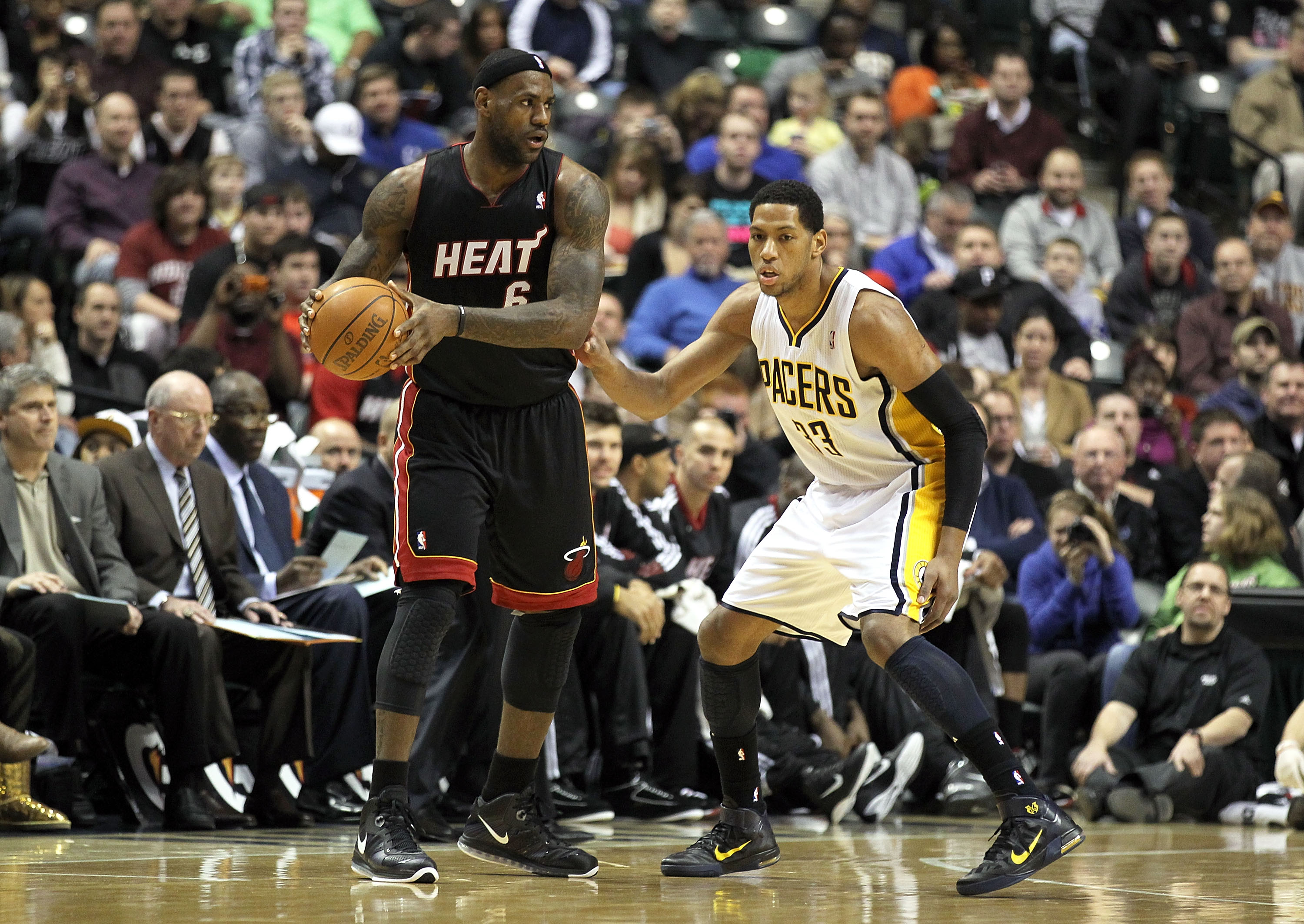 INDIANAPOLIS - FEBRUARY 15: LeBron James #6 of the Miami Heat is guarded by Danny Granger #33 of the Indiana Pacers during the NBA game at Conseco Fieldhouse on February 15, 2011 in Indianapolis, Indiana.   The Heat won 110-103.   NOTE TO USER: User expre