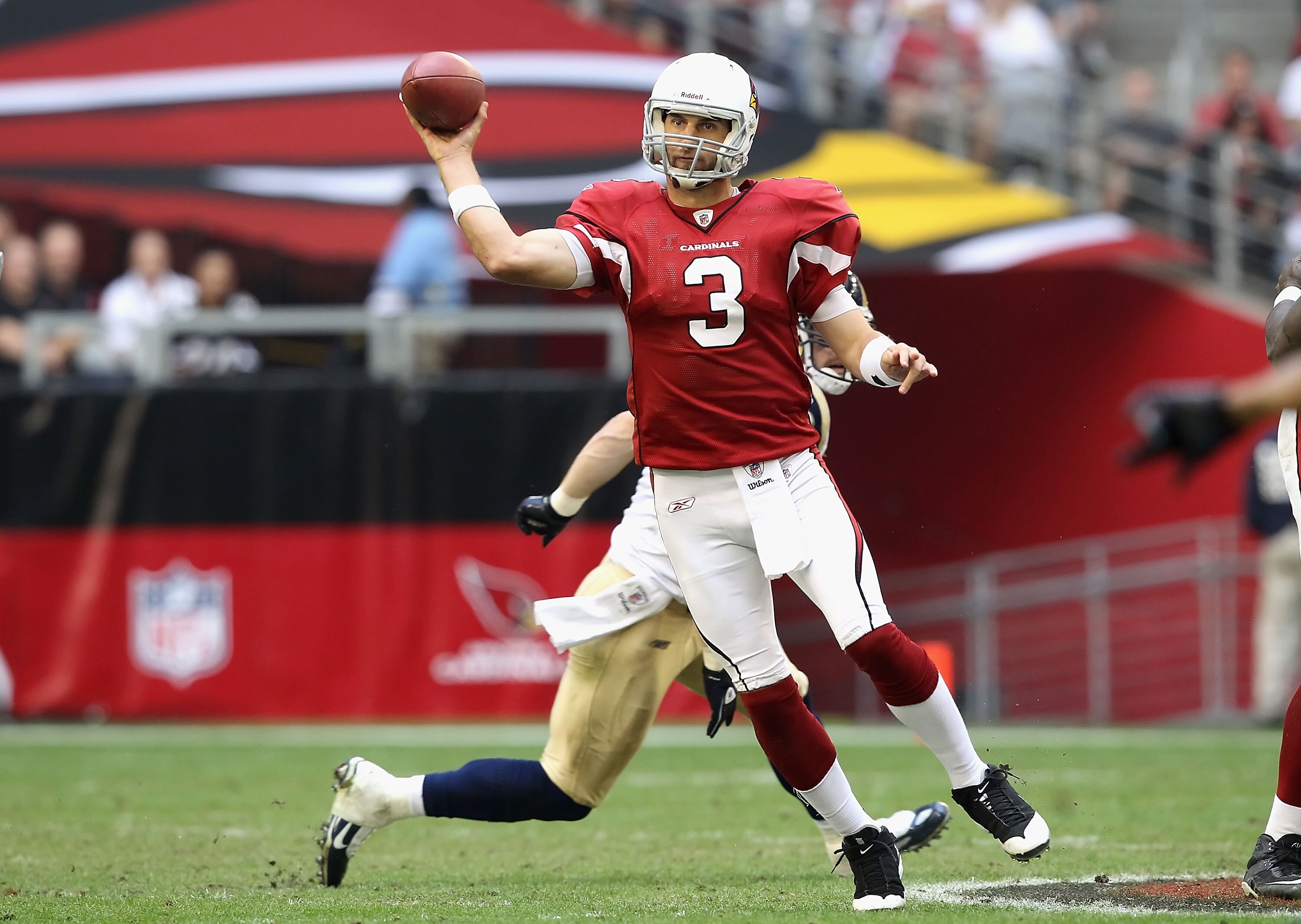 GLENDALE, AZ - DECEMBER 05:  Quarterback Derek Anderson #3 of the Arizona Cardinals scrambles to pass the football during the NFL game against the St. Louis Rams at the University of Phoenix Stadium on December 5, 2010 in Glendale, Arizona.  The Rams defe