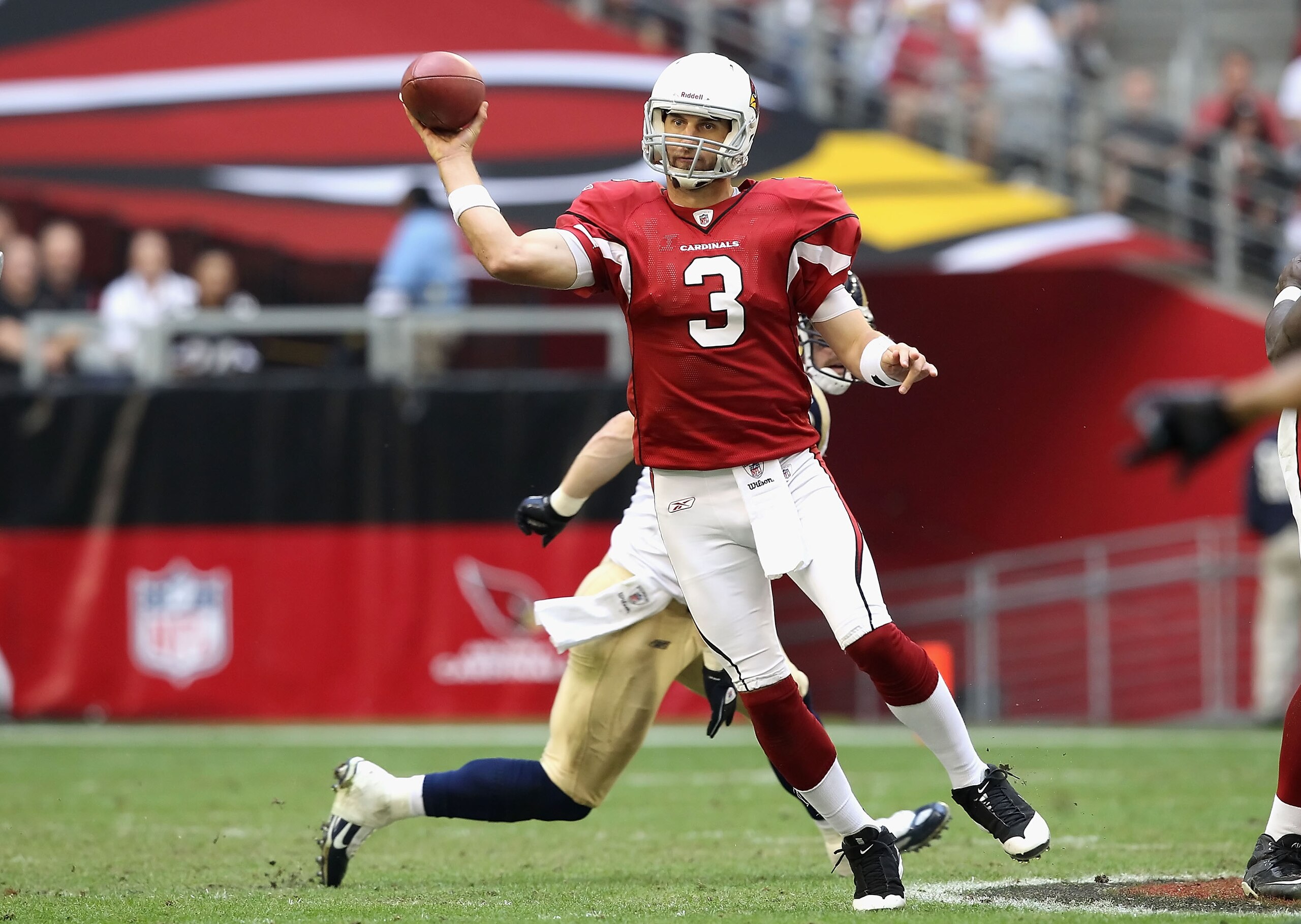 GLENDALE, AZ - DECEMBER 05:  Quarterback Derek Anderson #3 of the Arizona Cardinals scrambles to pass the football during the NFL game against the St. Louis Rams at the University of Phoenix Stadium on December 5, 2010 in Glendale, Arizona.  The Rams defe