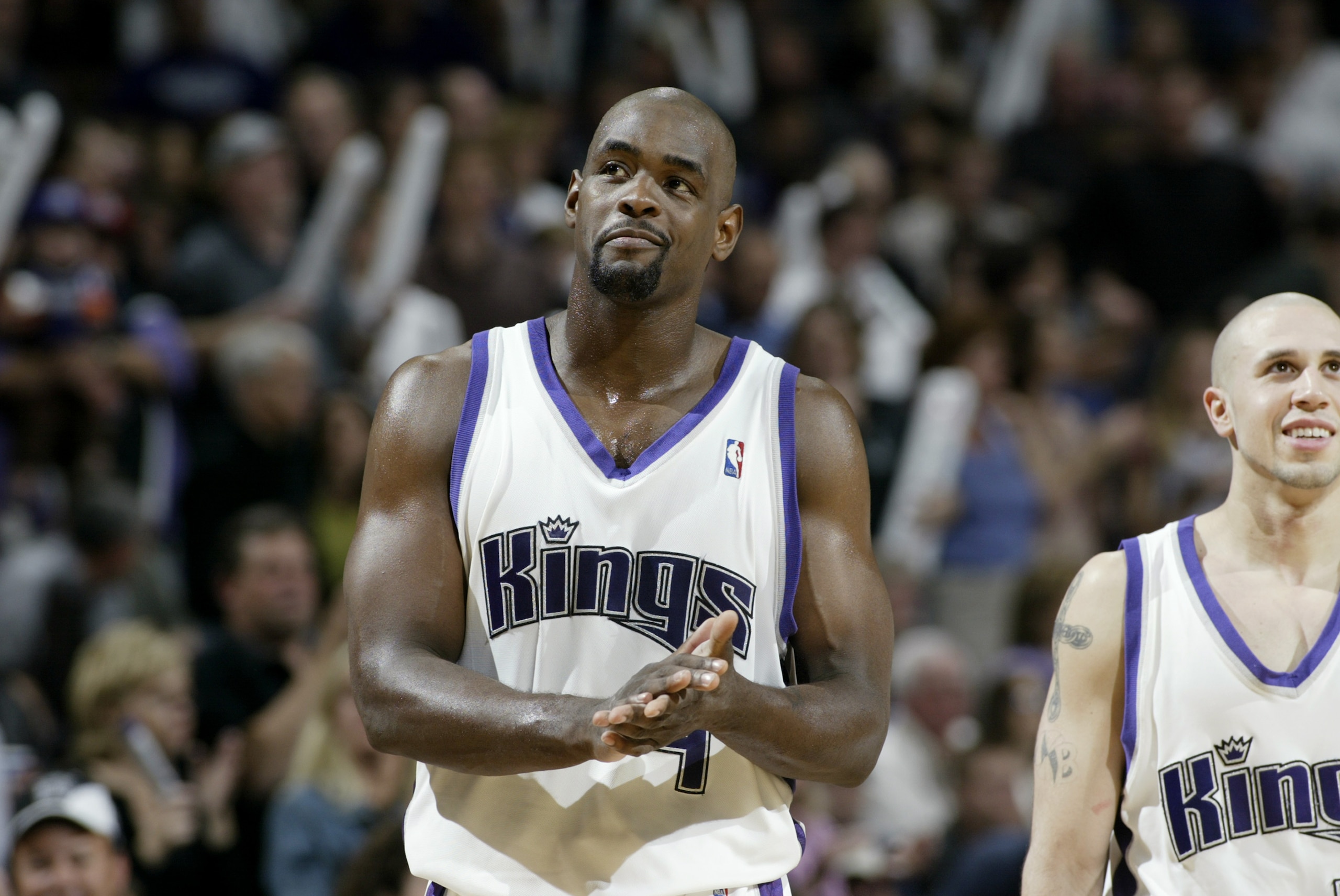 SACRAMENTO, CA - APRIL 30:  Chris Webber #4 of the Sacramento Kings claps near his teammate Mike Bibby #10 (R) in Game five of the Western Conference Quarterfinals against the Utah Jazz during the 2003 NBA Playoffs at Arco Arena on April 30, 2003 in Sacra