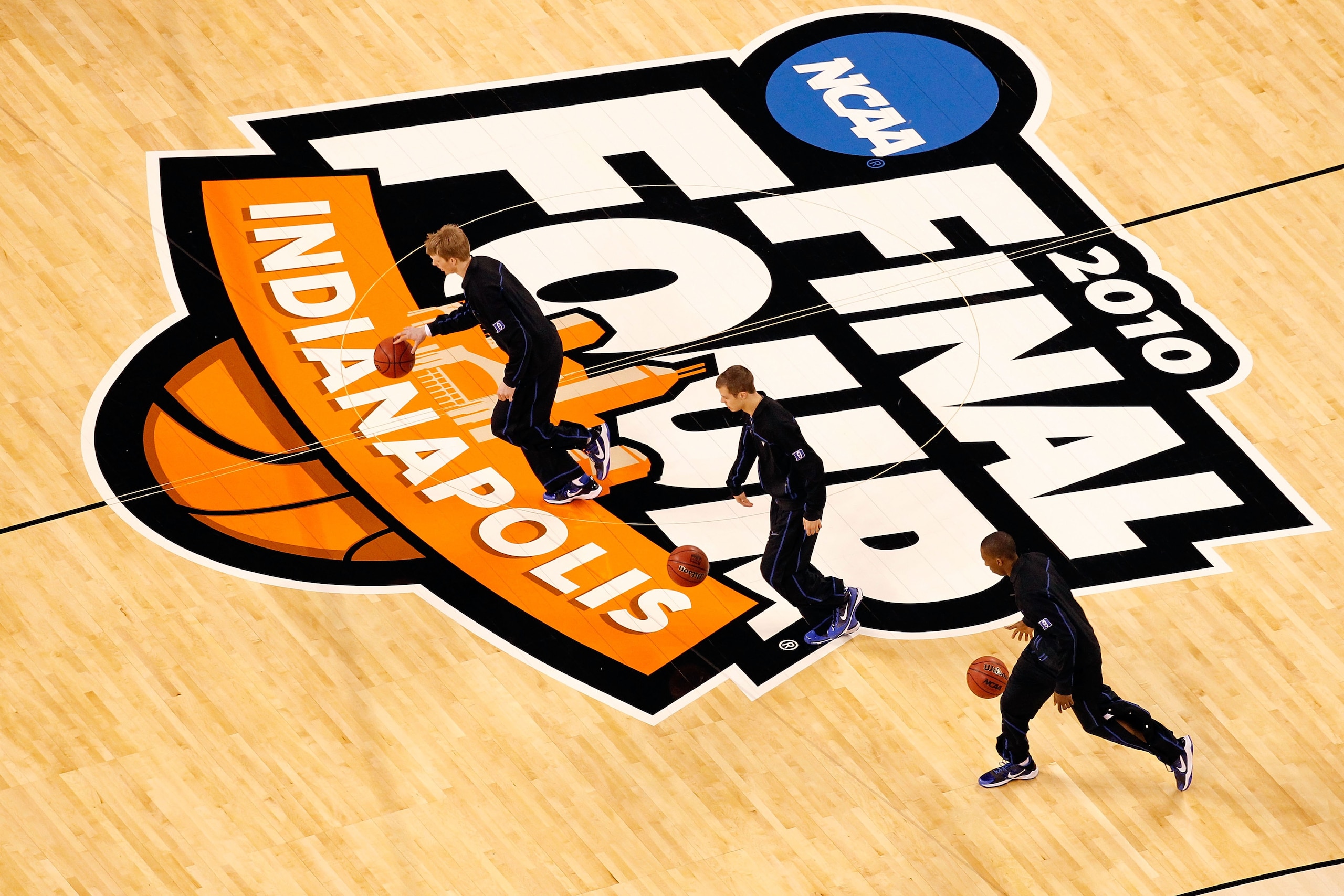 INDIANAPOLIS - APRIL 05:  (L-R) Kyle Singler #12, Jon Scheyer #30 and Nolan Smith #2 of the Duke Blue Devils warm up with teammates against the Butler Bulldogs during the 2010 NCAA Division I Men's Basketball National Championship game at Lucas Oil Stadiu