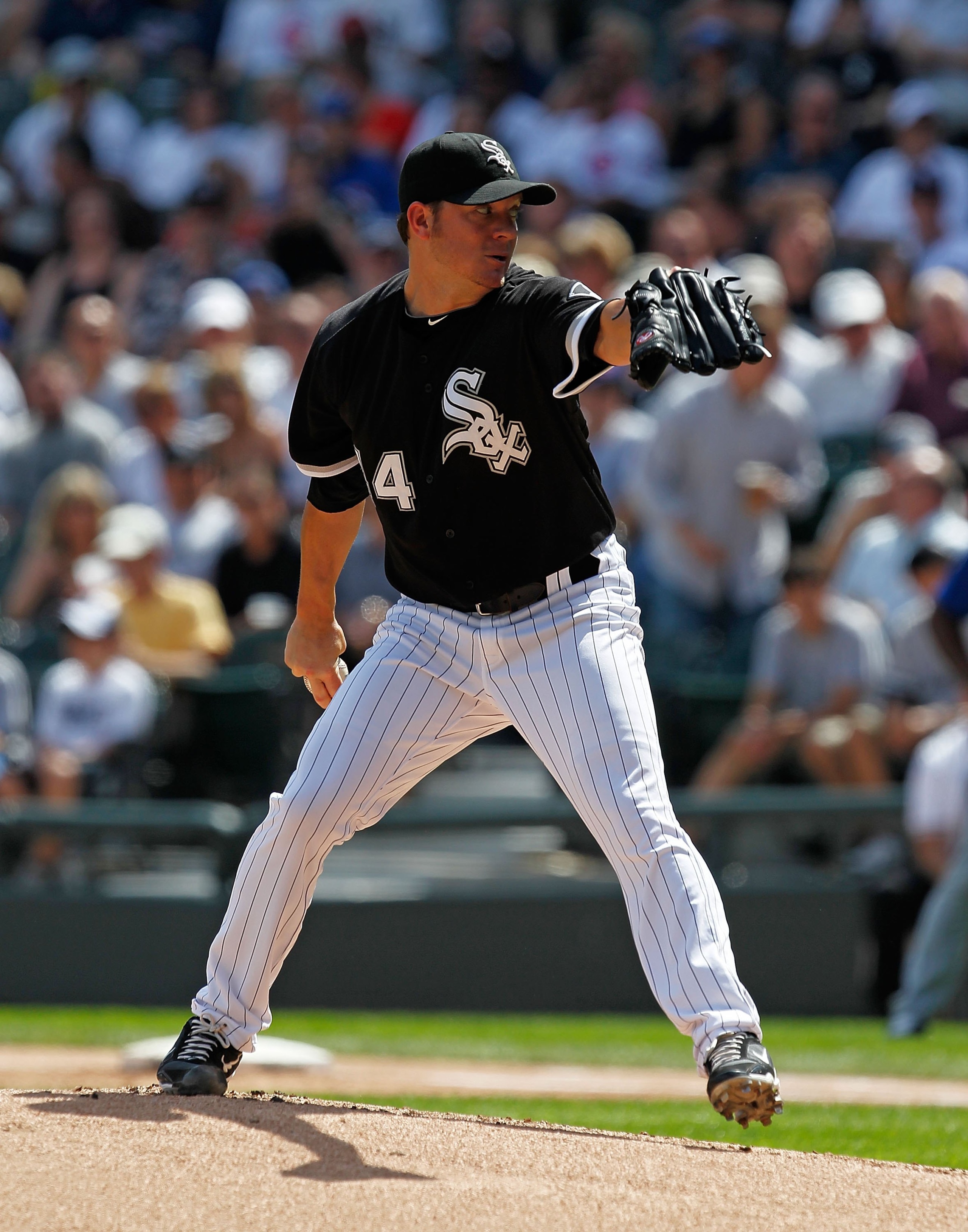 CHICAGO - JUNE 25: Starting pitcher Jake Peavy #44 of the Chicago White Sox delivers the ball against the Chicago Cubs at U.S. Cellular Field on June 25, 2010 in Chicago, Illinois. The White Sox defeated the Cubs 6-0. (Photo by Jonathan Daniel/Getty Image