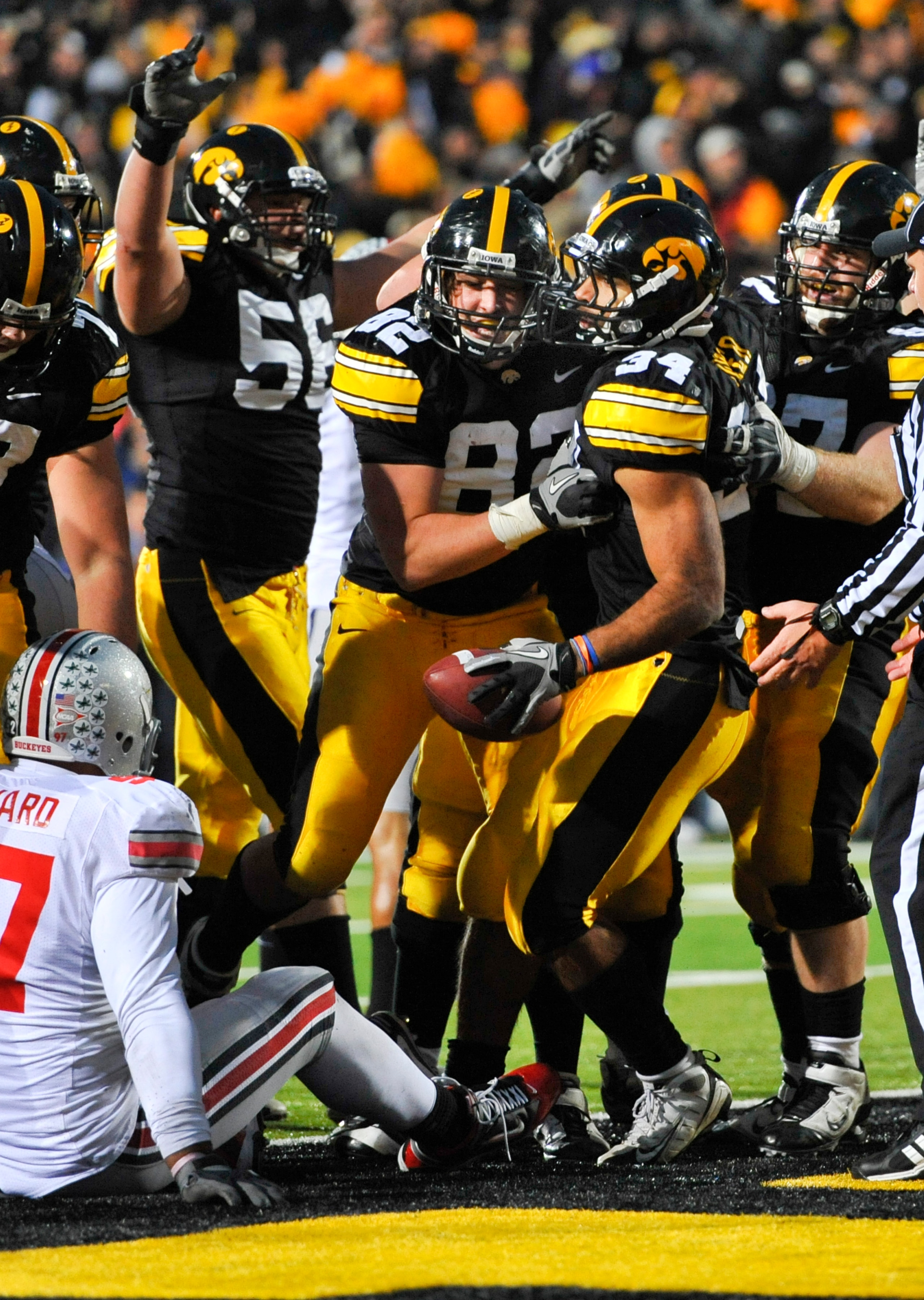 IOWA CITY, IA - NOVEMBER 20: Running back Marcus Coker #34 of the University of Iowa Hawkeyes celebrates with his teammates after scoring a touchdown against the Ohio State Buckeyes during the second half of play at Kinnick Stadium on November 20, 2010 in