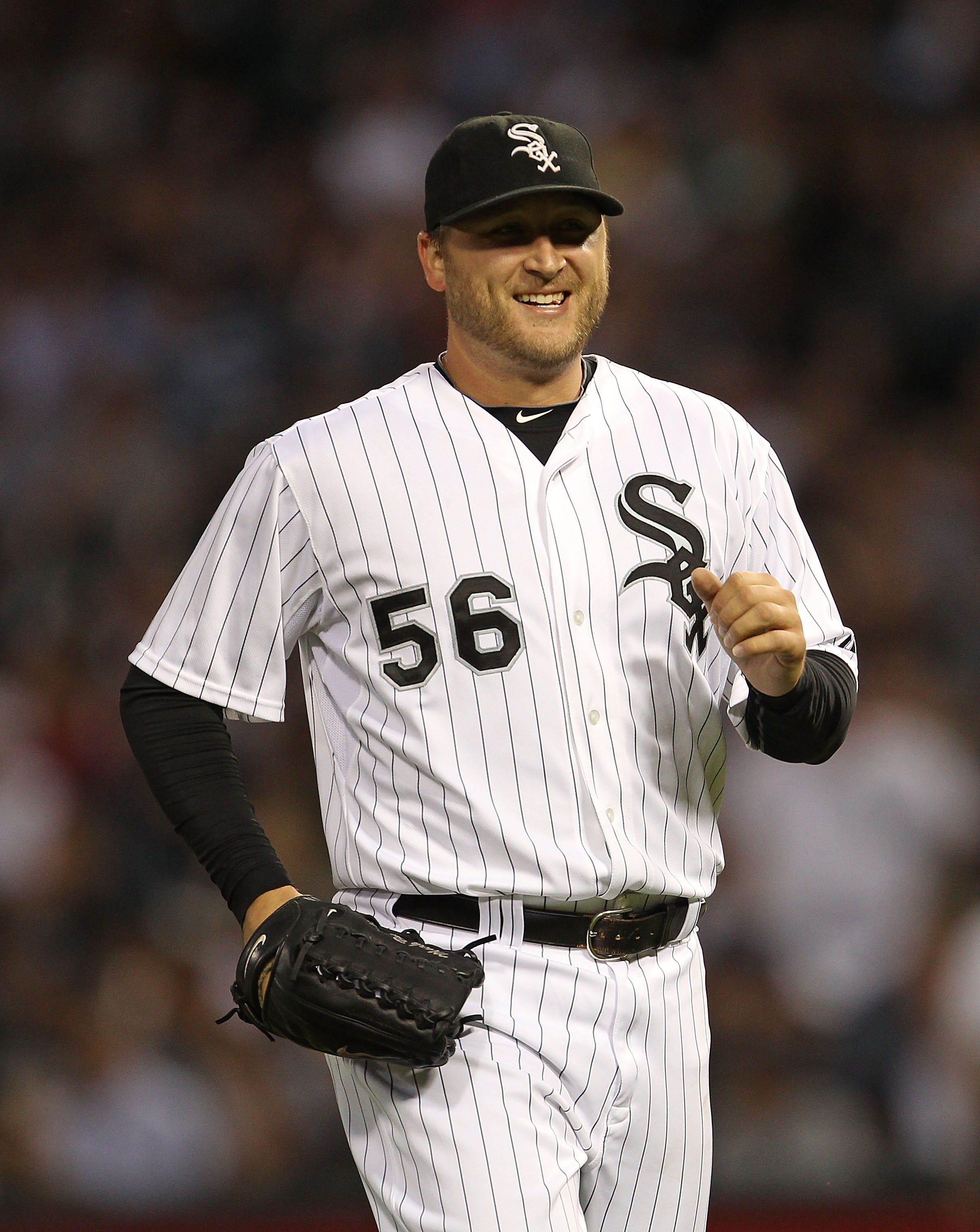 CHICAGO - AUGUST 25: Mark Buehrle #56 of the Chicago White Sox smiles as he leaves the field during a game against the Baltimore Orioles at U.S. Cellular Field on August 25, 2010 in Chicago, Illinois. The Orioles defeated the White Sox 4-2. (Photo by Jona