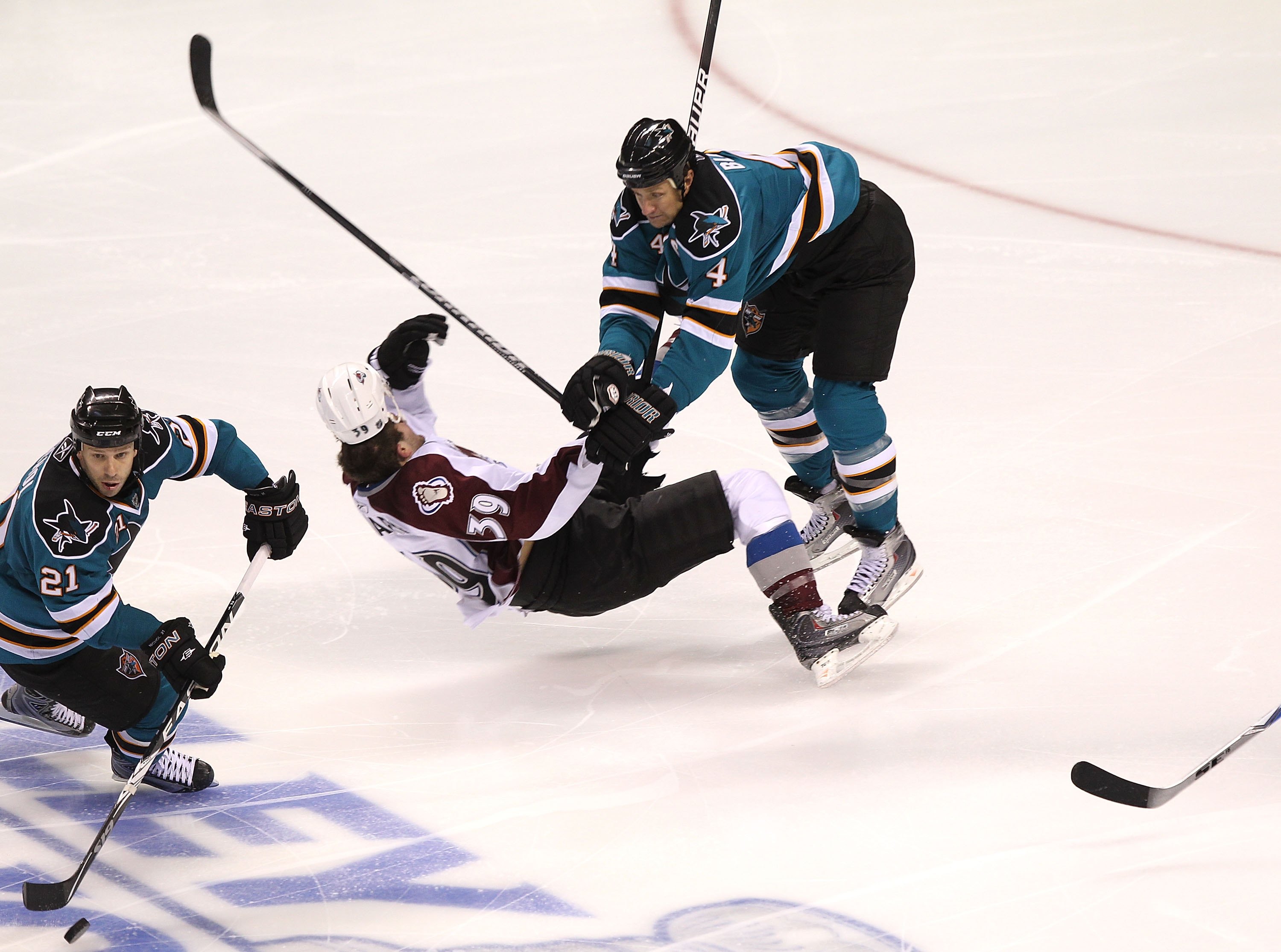 SAN JOSE, CA - APRIL 16:  Rob Blake #4 of the San Jose Sharks hits T.J. Galiardi #39 of the Colorado Avalanche in Game Two of the Western Conference Quarterfinals during the 2010 NHL Stanley Cup Playoffs at HP Pavilion on April 16, 2010 in San Jose, Calif
