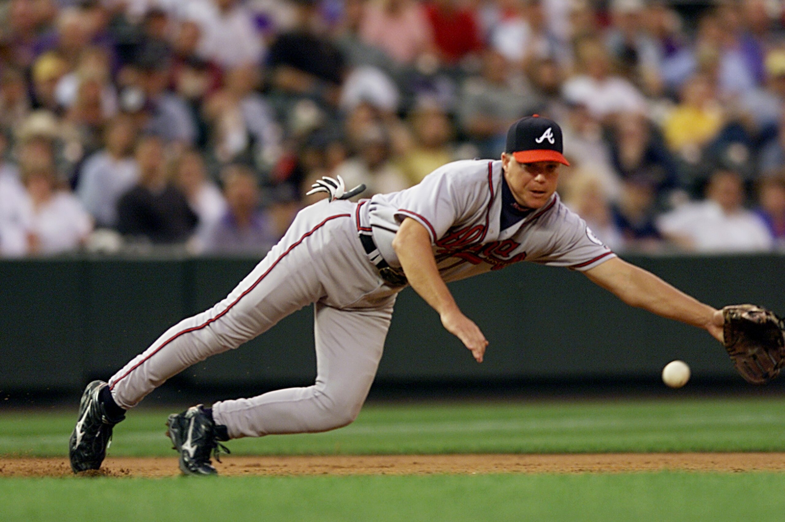 14 Aug 2001:  Third baseman Chipper Jones of the Atlanta Braves dives for a ground ball but can''t reach it in the second inning against the Colorado Rockies at Coors Field in Denver, Colorado.  <DIGITAL IMAGE> Mandatory Credit: Brian Bahr/ALLSPORT