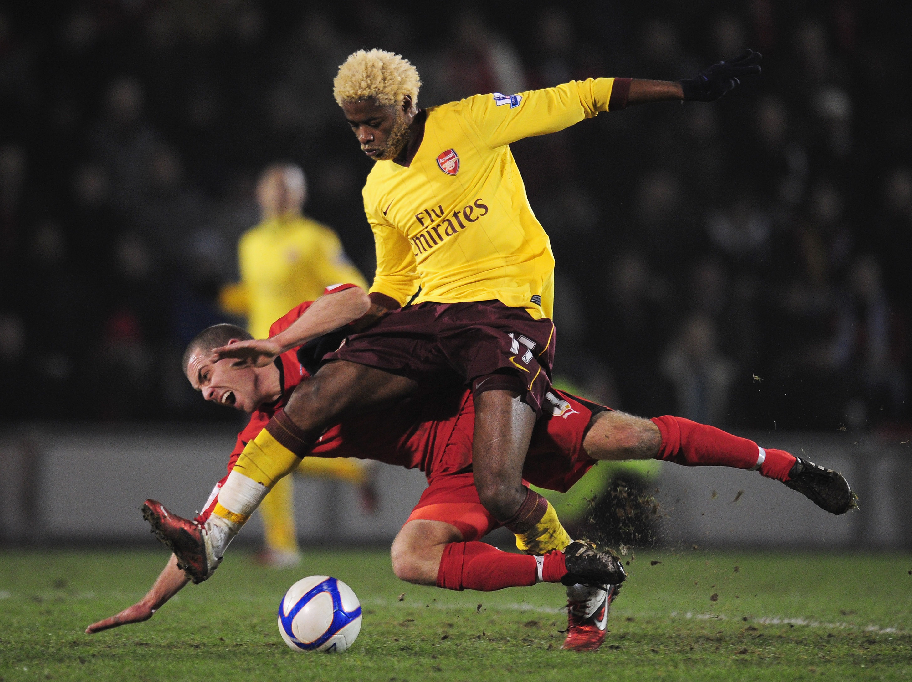 LONDON, ENGLAND - FEBRUARY 20:   Alex Song of Arsenal challenges Stephen Dawson of Leyton Orient during the FA Cup sponsored by E.ON 5th Round match between Leyton Orient and Arsenal at the Matchroom Stadium on February 20, 2011 in London, England.  (Phot