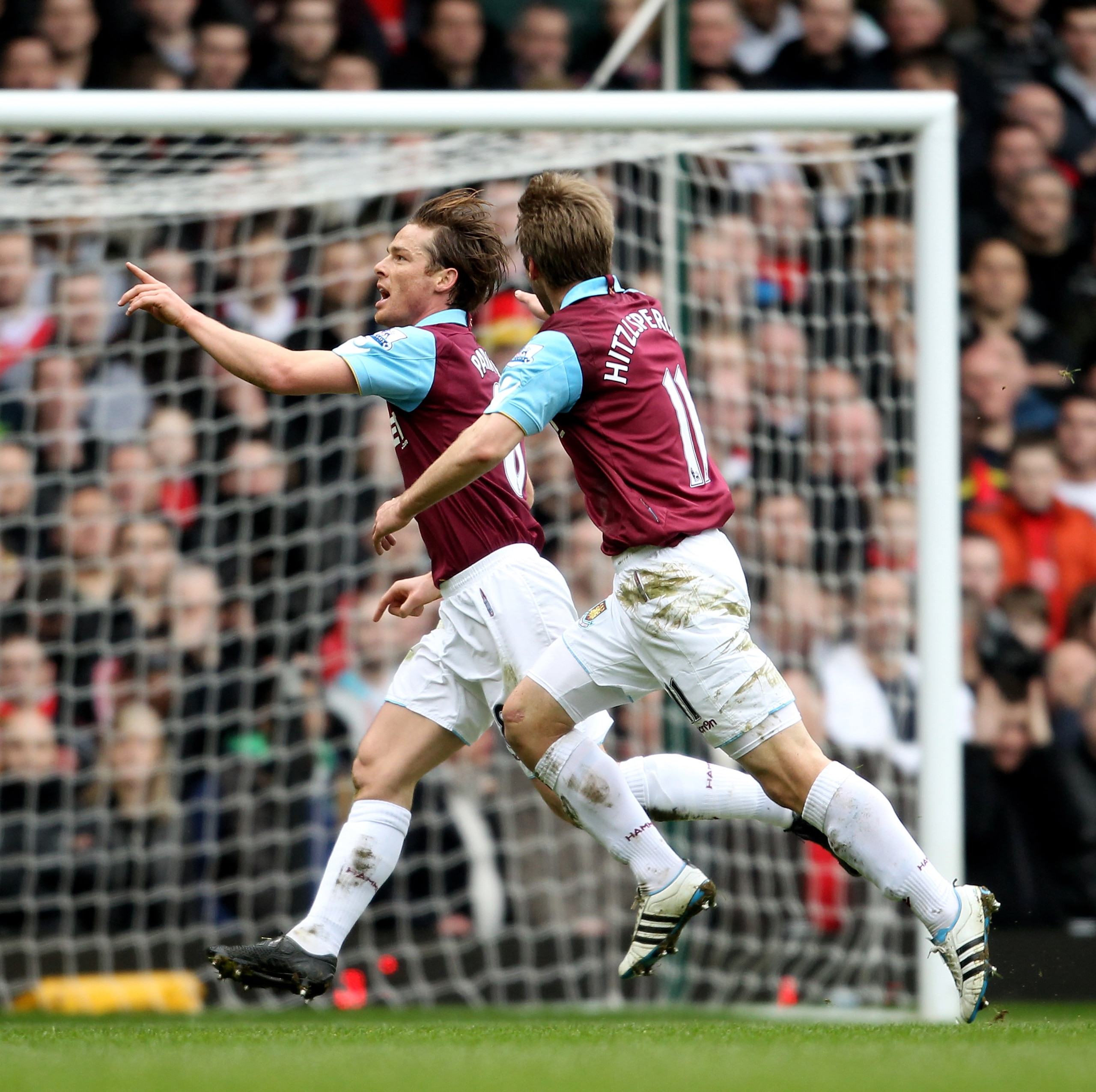 LONDON, ENGLAND - FEBRUARY 27: Scott Parker (L) of West Ham celebrates with teammate Thomas Hitzlsperger as he scores the opening goal during the Barclays Premier League match between West Ham United and Liverpool at the Boleyn Ground on February 27, 201 LONDON, ENGLAND - FEBRUARY 27: Scott Parker (L) of West Ham celebrates with teammate Thomas Hitzlsperger as he scores the opening goal during the Barclays Premier League match between West Ham United and Liverpool at the Boleyn Ground on February 27, 201