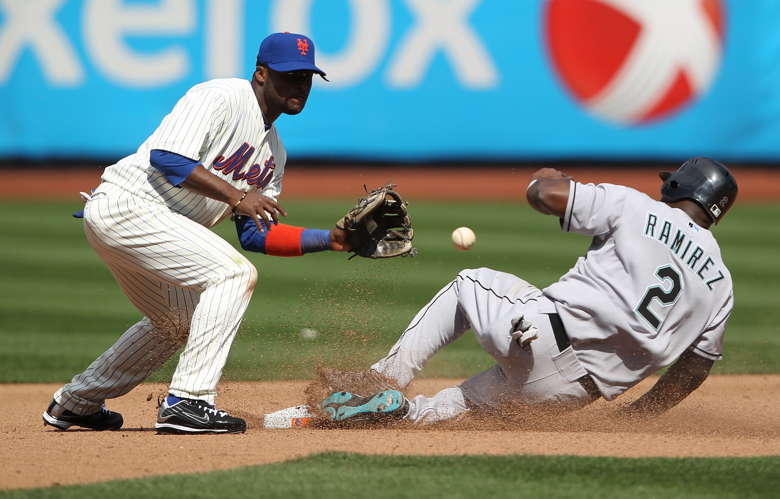 NEW YORK - APRIL 05: Hanley Ramirez #2 of the Florida Marlins steals second under the tag of Luis Castillo #1 of the New York Mets in the fourth inning during their Opening Day Game at Citi Field on April 5, 2010 in the Flushing neighborhood of the Queens
