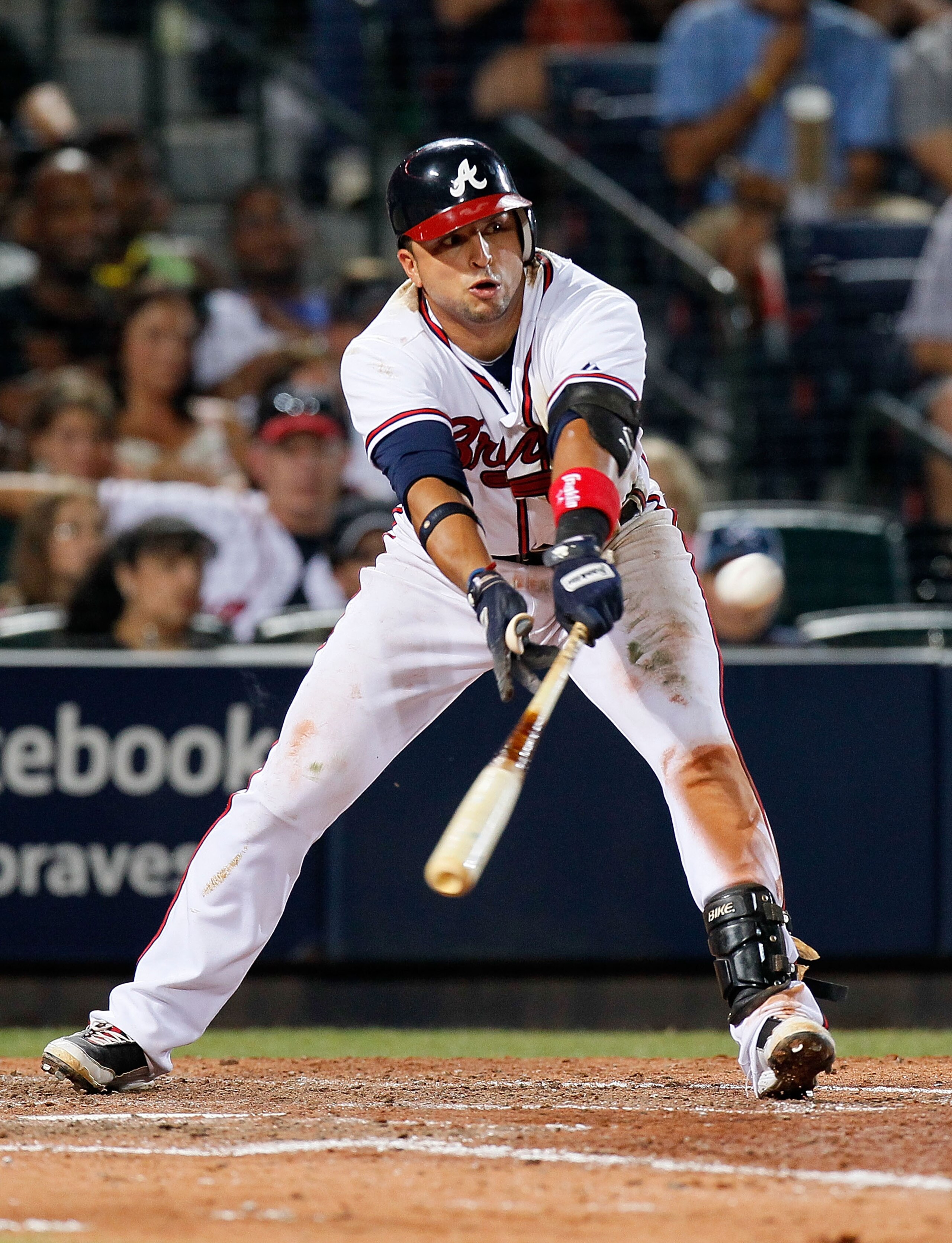 ATLANTA - JULY 02:  Martin Prado #14 of the Atlanta Braves hits a one-run single in the seventh inning against the Florida Marlins at Turner Field on July 2, 2010 in Atlanta, Georgia.  (Photo by Kevin C. Cox/Getty Images)