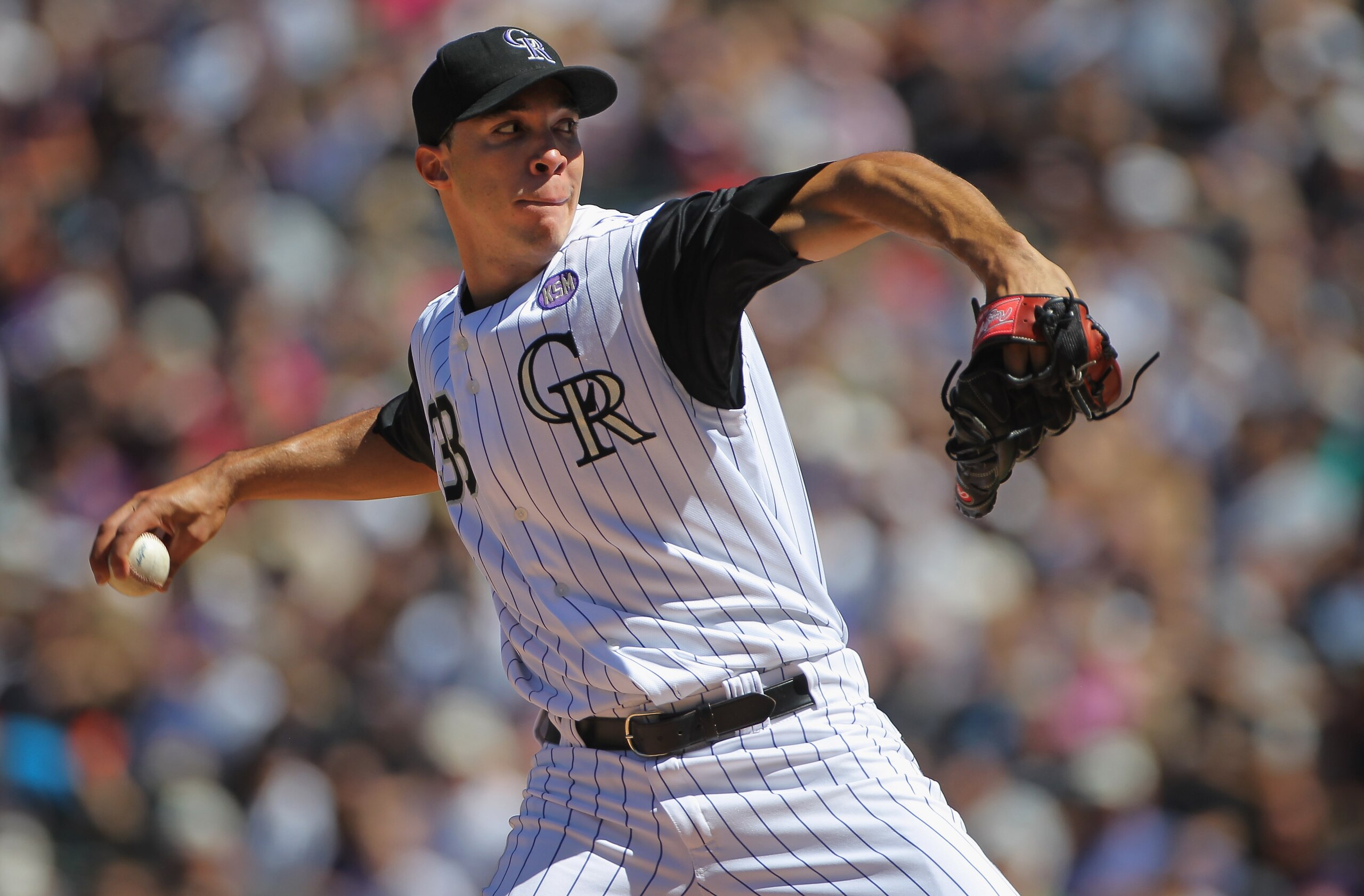 DENVER - SEPTEMBER 06:  Starting pitcher Ubaldo Jimenez #38 of the Colorado Rockies delivers against the Cincinnati Reds at Coors Field on September 6, 2010 in Denver, Colorado. The Rockies defeated the Reds 10-5 as Jimenez earned a club record 18th victo