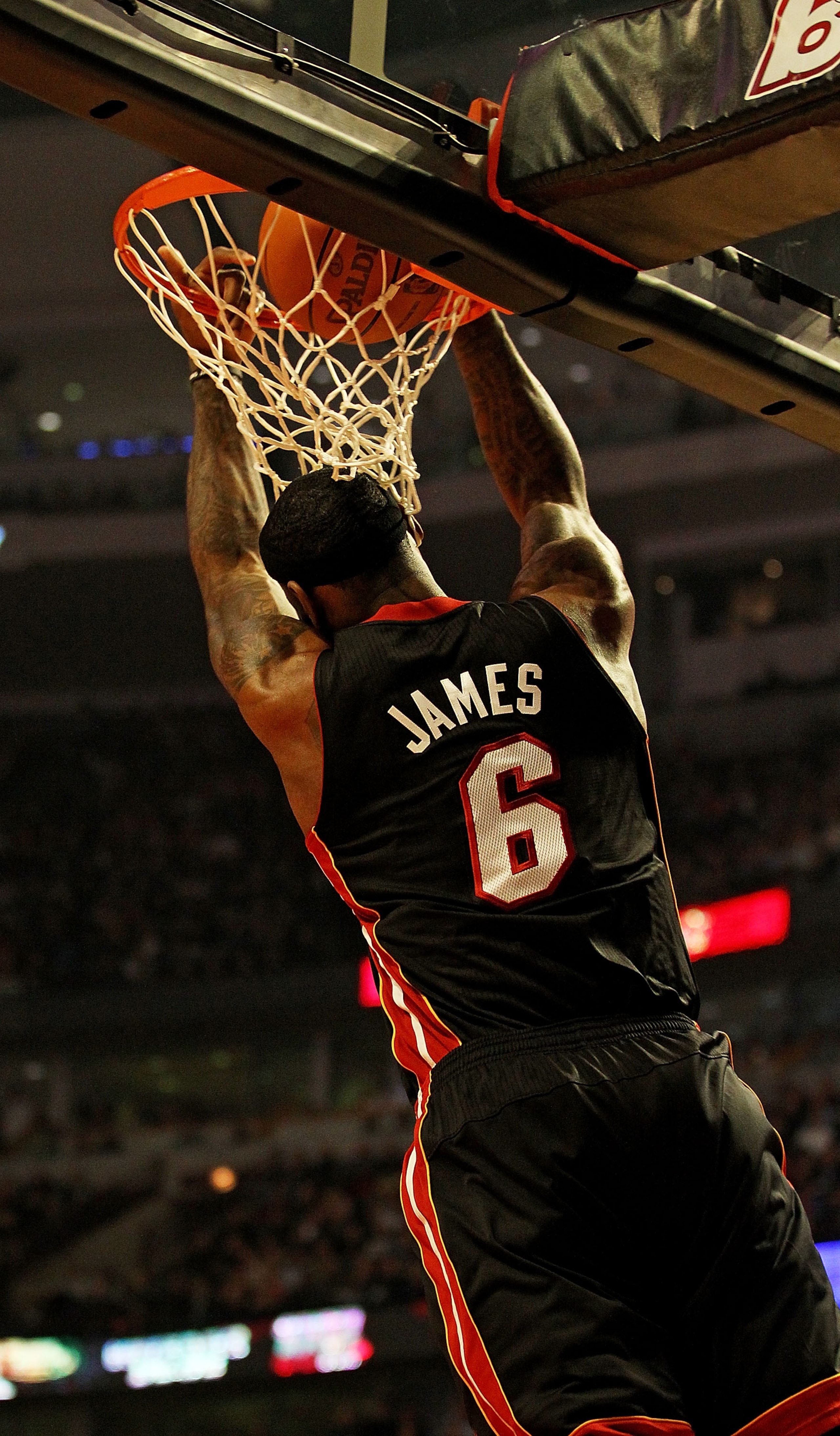 CHICAGO, IL - FEBRUARY 24: LeBron James #6 of the Miami Heat puts in a reverse dunk against the Chicago Bulls at the United Center on February 24, 2011 in Chicago, Illinois. NOTE TO USER: User expressly acknowledges and agrees that, by downloading and/or