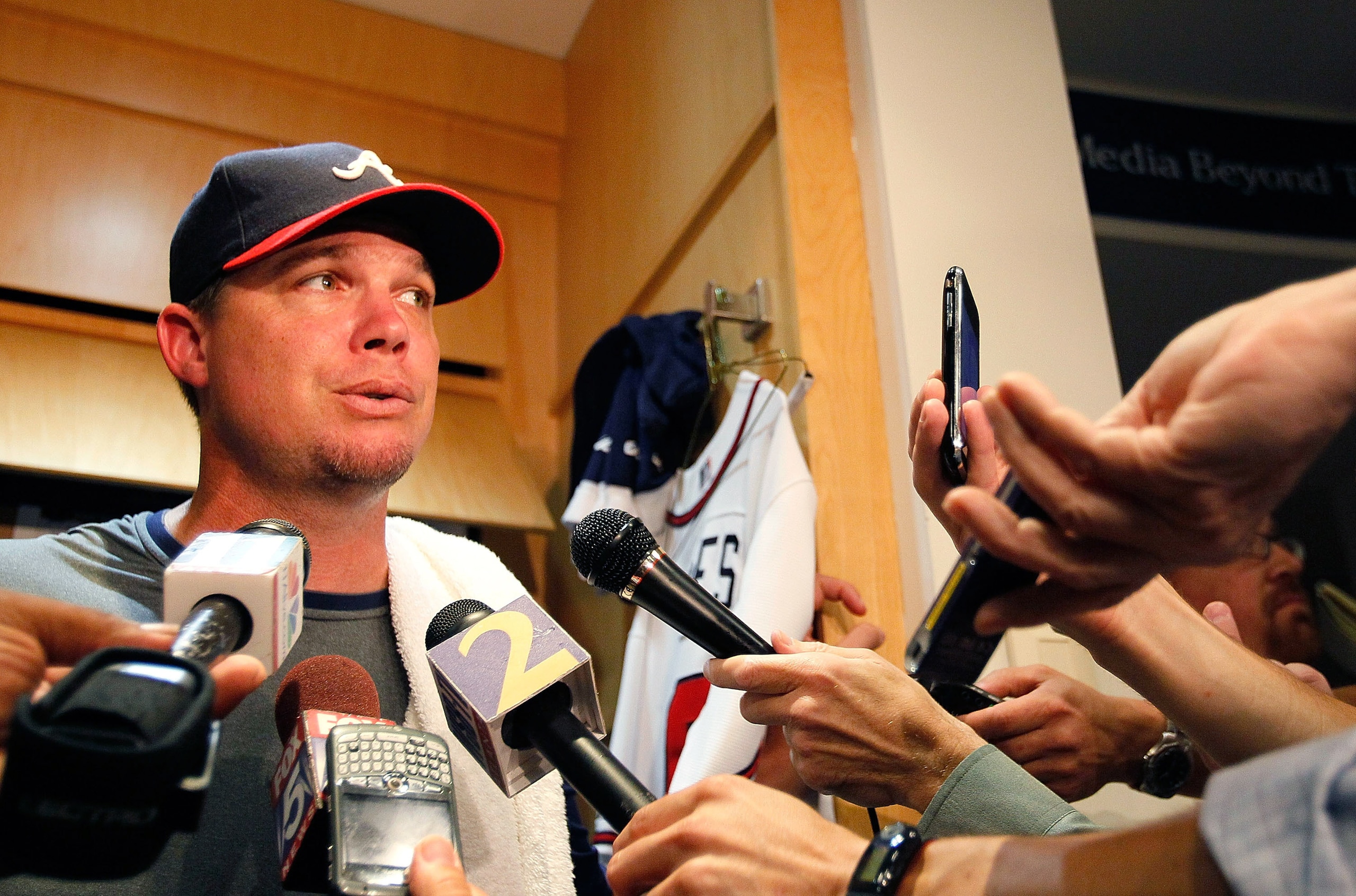 ATLANTA - JUNE 17:  Chipper Jones #10 of the Atlanta Braves holds a press conference at his locker in the team clubhouse to address his retirement before facing the Tampa Bay Rays at Turner Field on June 17, 2010 in Atlanta, Georgia.  (Photo by Kevin C. C