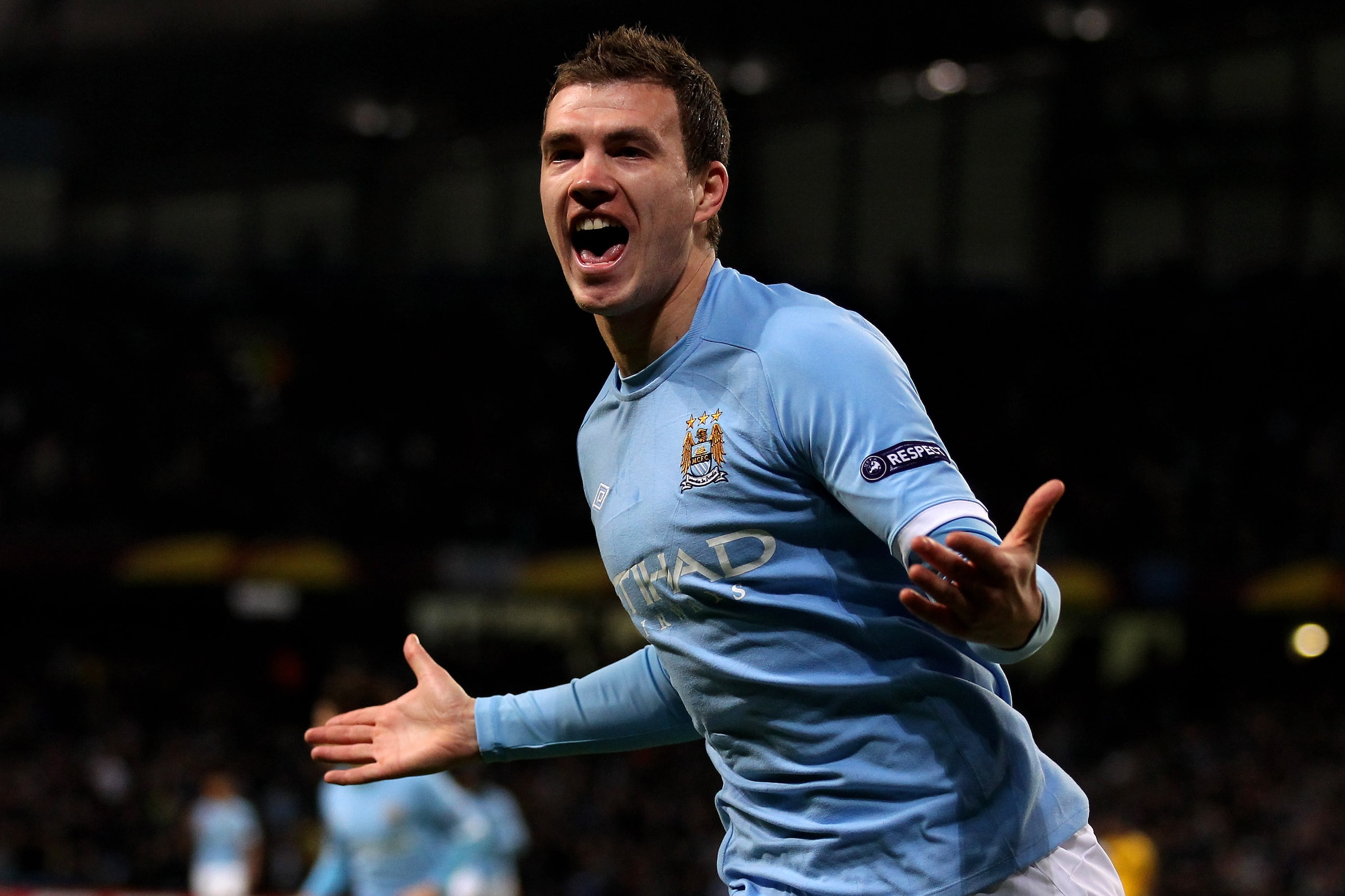 MANCHESTER, ENGLAND - FEBRUARY 24: Edin Dzeko of City celebrates as he scores the opening goal during the UEFA Europa League round of 32 second leg match between Manchester City and Aris Saloniki at City of Manchester Stadium on February 24, 2011 in Manc MANCHESTER, ENGLAND - FEBRUARY 24: Edin Dzeko of City celebrates as he scores the opening goal during the UEFA Europa League round of 32 second leg match between Manchester City and Aris Saloniki at City of Manchester Stadium on February 24, 2011 in Manc