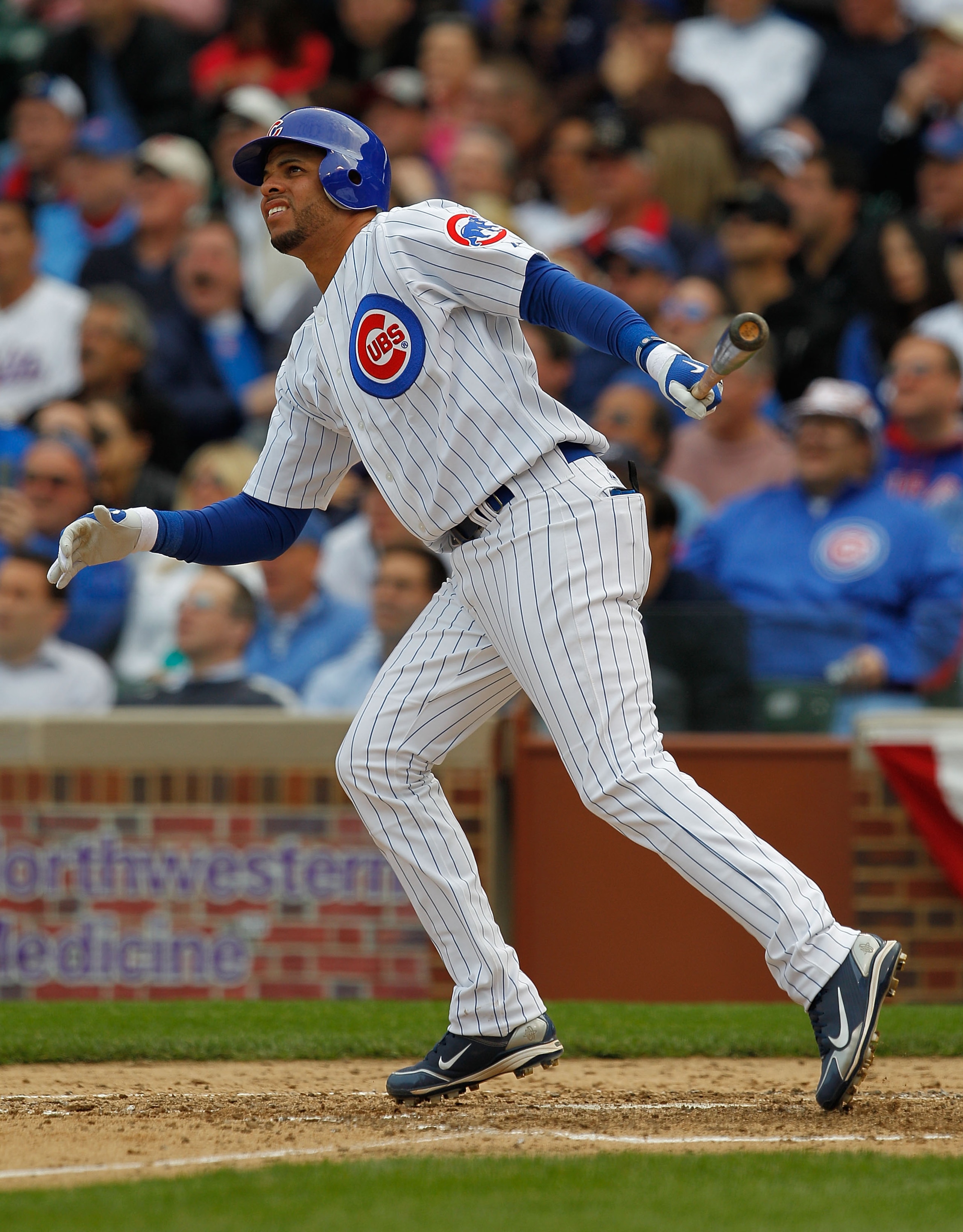CHICAGO - APRIL 12: Aramis Ramirez #16 of the Chicago Cubs follows the flight of his fourth inning home run against the Milwaukee Brewers on Opening Day at Wrigley Field on April 12, 2010 in Chicago, Illinois. (Photo by Jonathan Daniel/Getty Images)