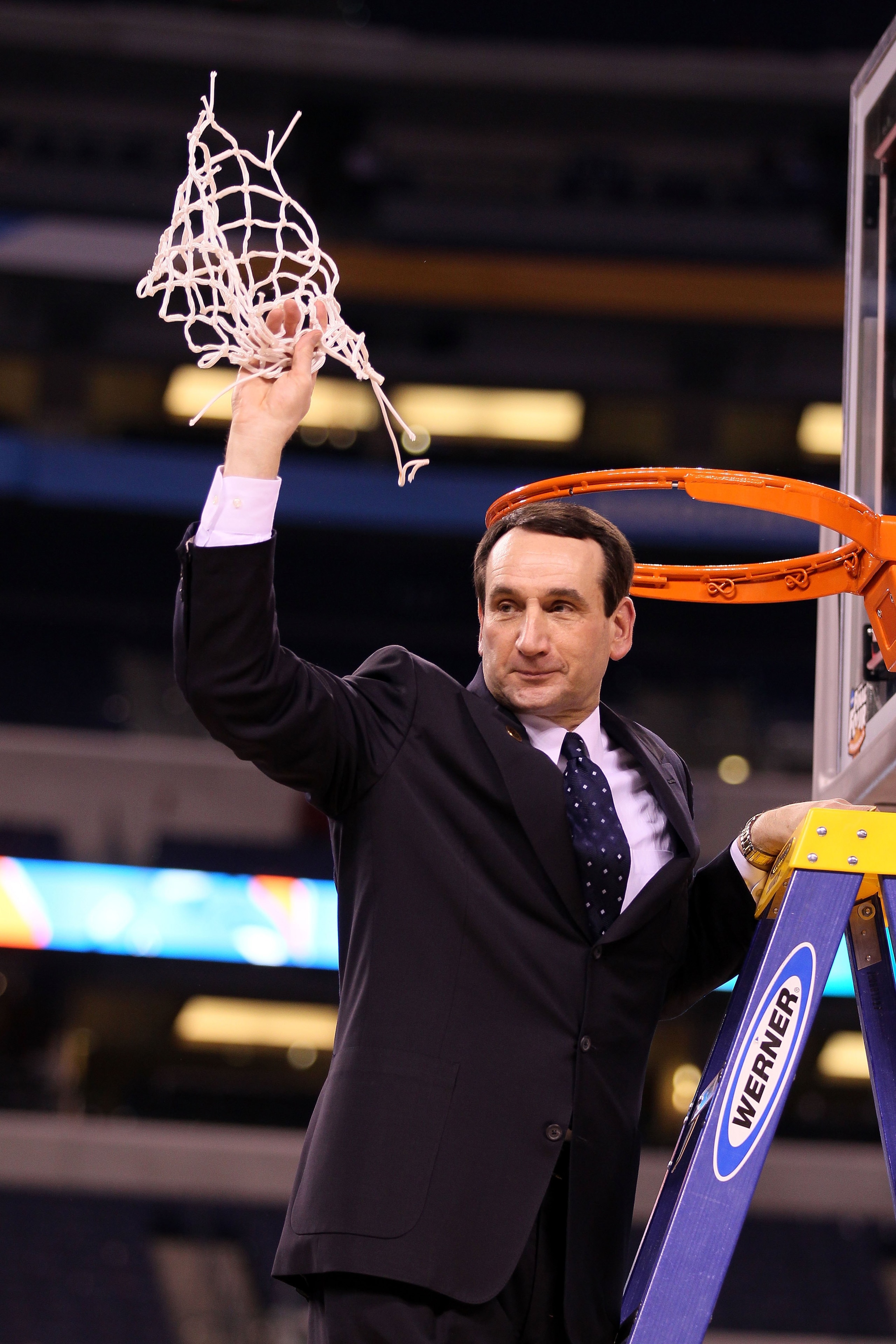 INDIANAPOLIS - APRIL 05:  Head coach Mike Krzyzewski of the Duke Blue Devils celebrates after he cut down a piece of the net following their 61-59 win against the Butler Bulldogs during the 2010 NCAA Division I Men's Basketball National Championship game