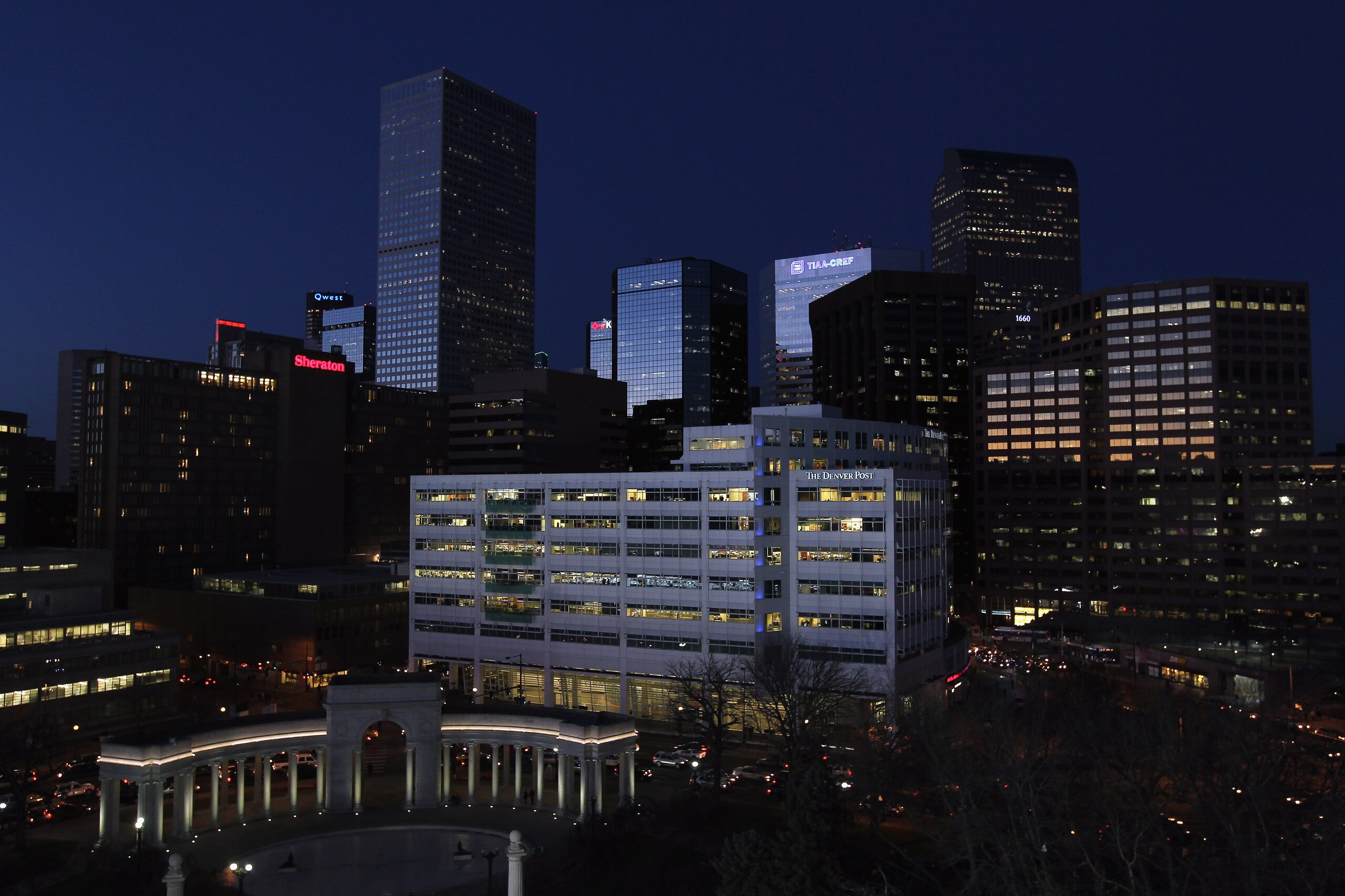 DENVER, CO - JANUARY 26:  The Denver downtown skyline basks in the glow of the twilight during the LG FIS World Cup Snowboard Big Air Event in Civic Center Park on January 26, 2011 in Denver, Colorado. The ramp is a steel truss scaffolding 106 feet high,