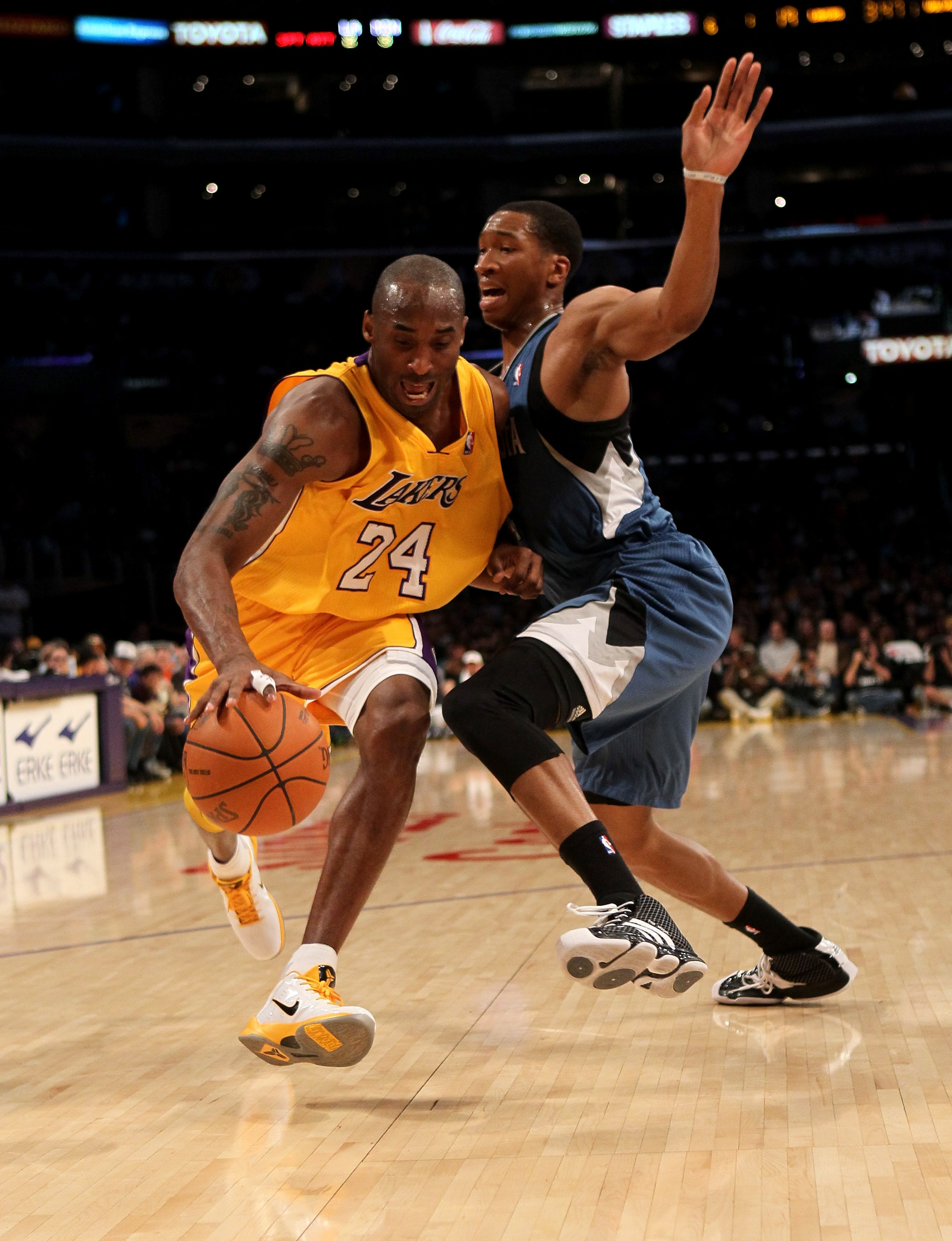 LOS ANGELES - NOVEMBER 9: Kobe Bryant #24 of the Los Angeles Lakers drives past Wes Johnson #4 of the Minnesota Timberwolves at Staples Center on November 9, 2010 in Los Angeles, California. NOTE TO USER: User expressly acknowledges and agrees that, by LOS ANGELES - NOVEMBER 9: Kobe Bryant #24 of the Los Angeles Lakers drives past Wes Johnson #4 of the Minnesota Timberwolves at Staples Center on November 9, 2010 in Los Angeles, California. NOTE TO USER: User expressly acknowledges and agrees that, by