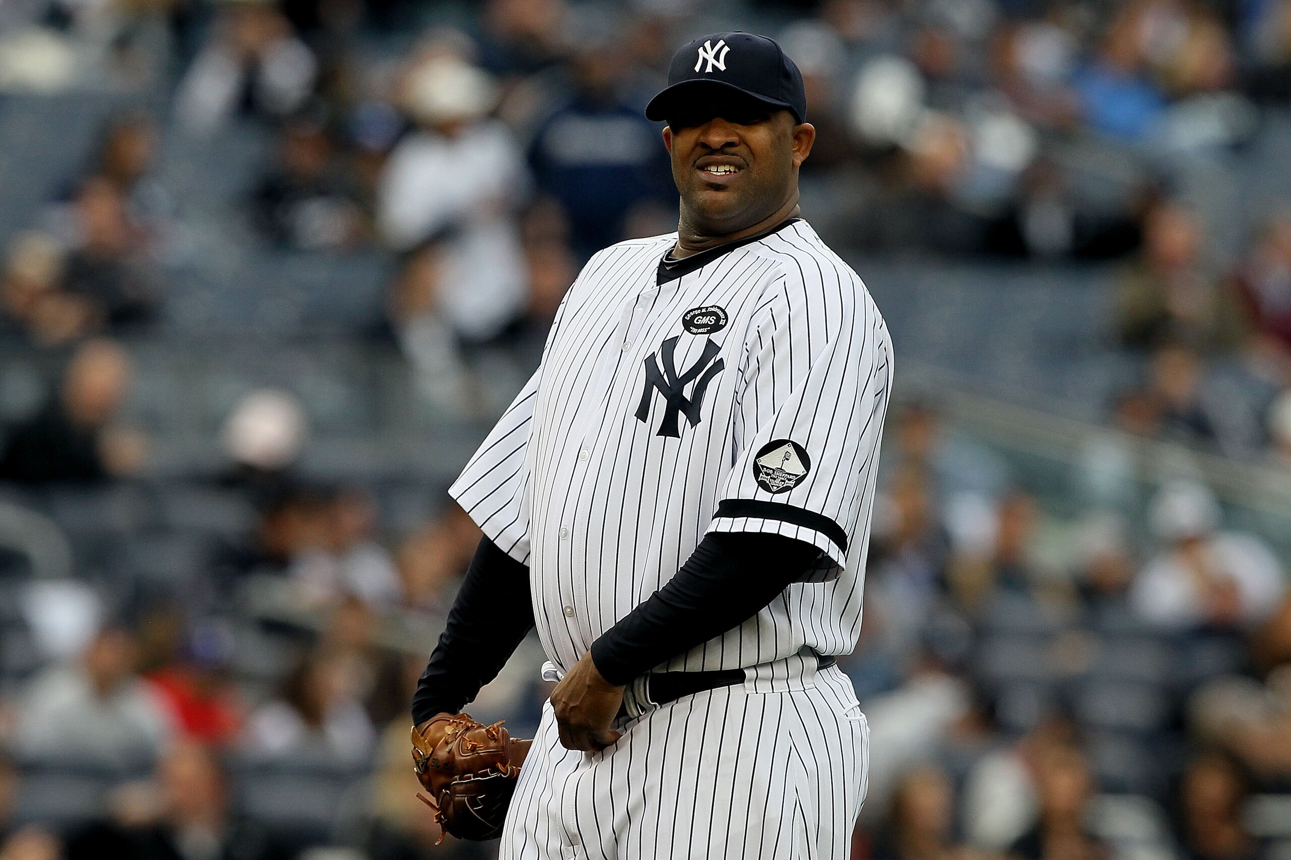 NEW YORK - OCTOBER 20:  CC Sabathia #52 of the New York Yankees reacts against the Texas Rangers in Game Five of the ALCS during the 2010 MLB Playoffs at Yankee Stadium on October 20, 2010 in the Bronx borough of New York City.  (Photo by Jim McIsaac/Gett