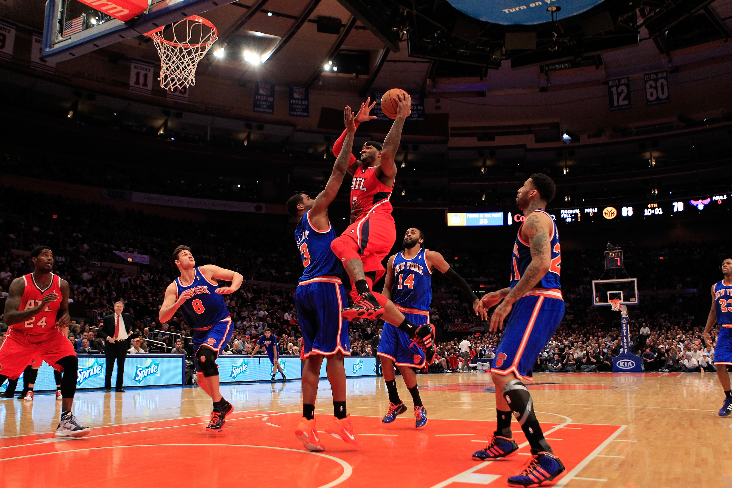 NEW YORK, NY - FEBRUARY 16:  Josh Smith #5 of the Atlanta Hawks shoots over Shawne Williams #3 of the New York Knicks at Madison Square Garden on February 16, 2011 in New York City. NOTE TO USER: User expressly acknowledges and agrees that, by downloading