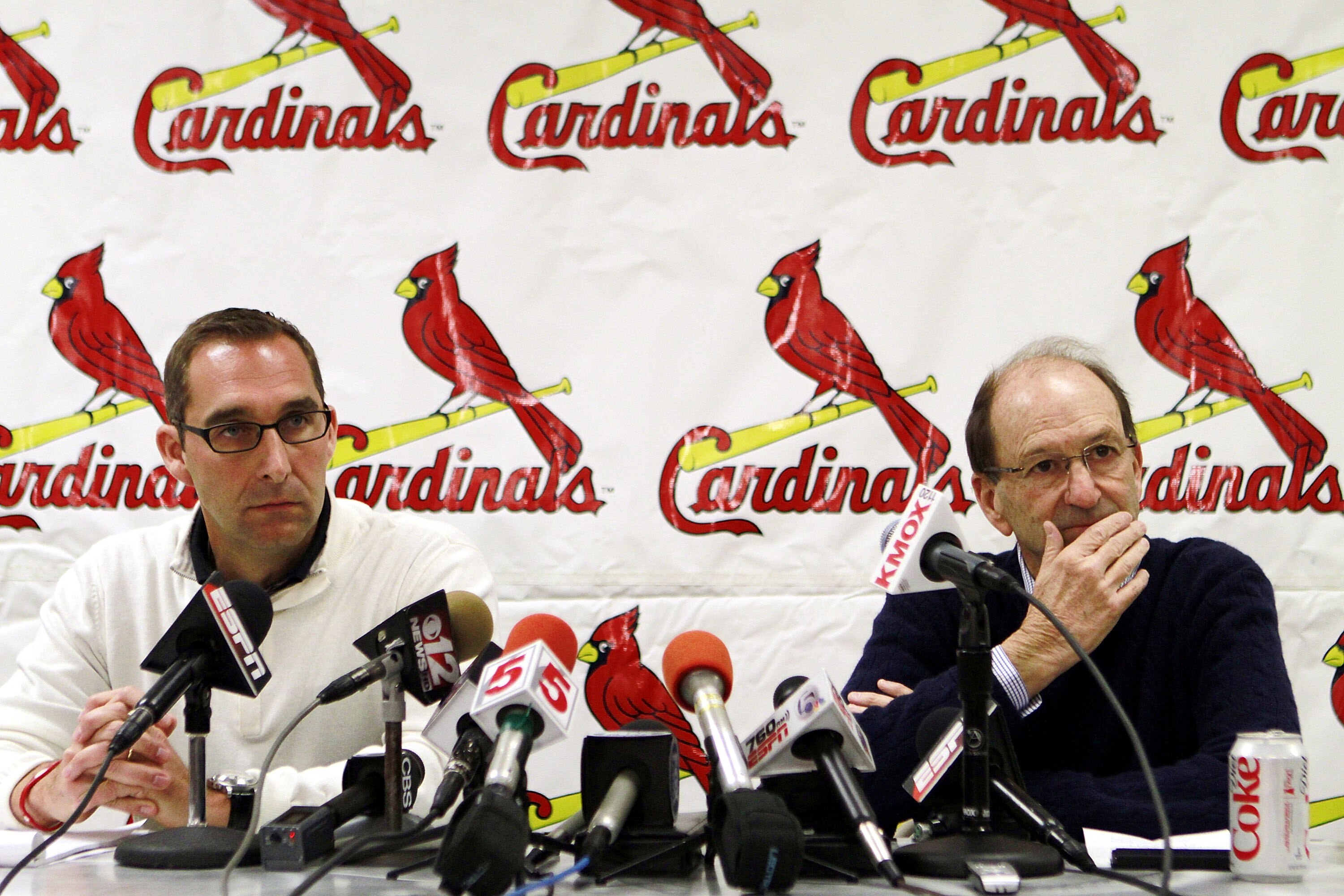 JUPITER, FL - FEBRUARY 16:  General Manager John Mozeliak (L) and owner William DeWitt, Jr. of the St. Louis Cardinals speak at a press conference at Roger Dean Stadium on February 16, 2011 in Jupiter, Florida.  (Photo by Marc Serota/Getty Images)