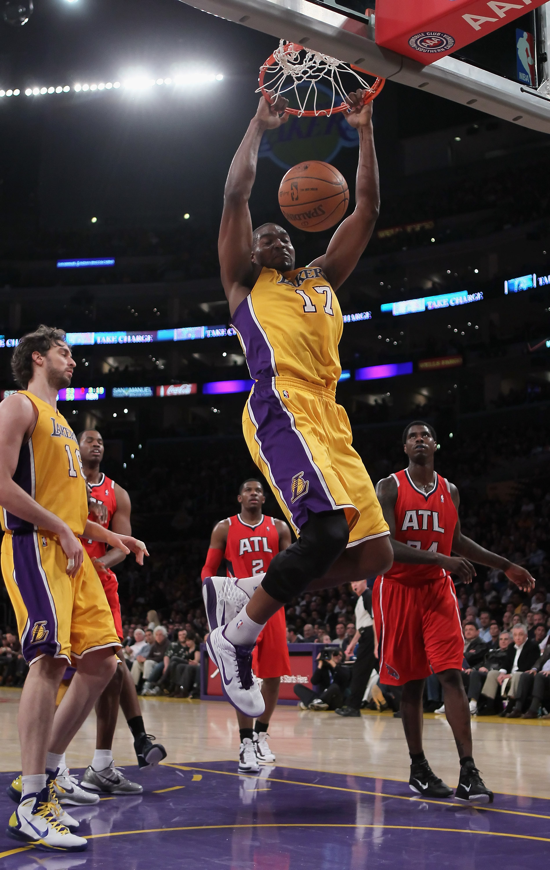 LOS ANGELES, CA - FEBRUARY 22:  Andrew Bynum #17 of the Los Angeles Lakers drives to the basket for a dunk against the Atlanta Hawks in the first half at Staples Center on February 22, 2011 in Los Angeles, California. NOTE TO USER: User expressly acknowle