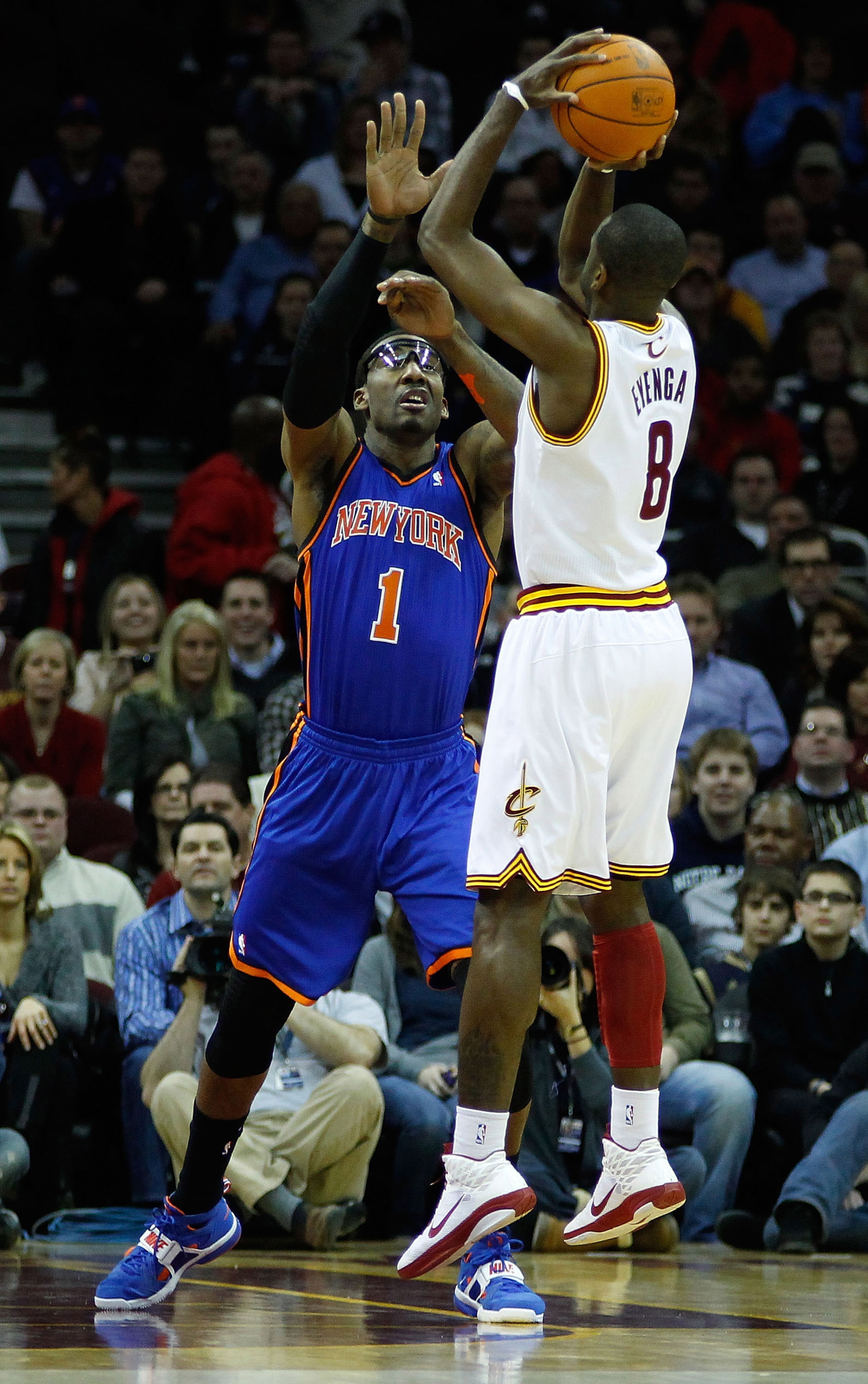 CLEVELAND, OH  - FEBRUARY 25:  Christian Eyenga #8 of the Cleveland Cavaliers puts up a shot in front of Amar'e Stoudemire #1 of the New York Knicks during the game on February 25, 2011 at Quicken Loans Arena in Cleveland, Ohio. NOTE TO USER: User express