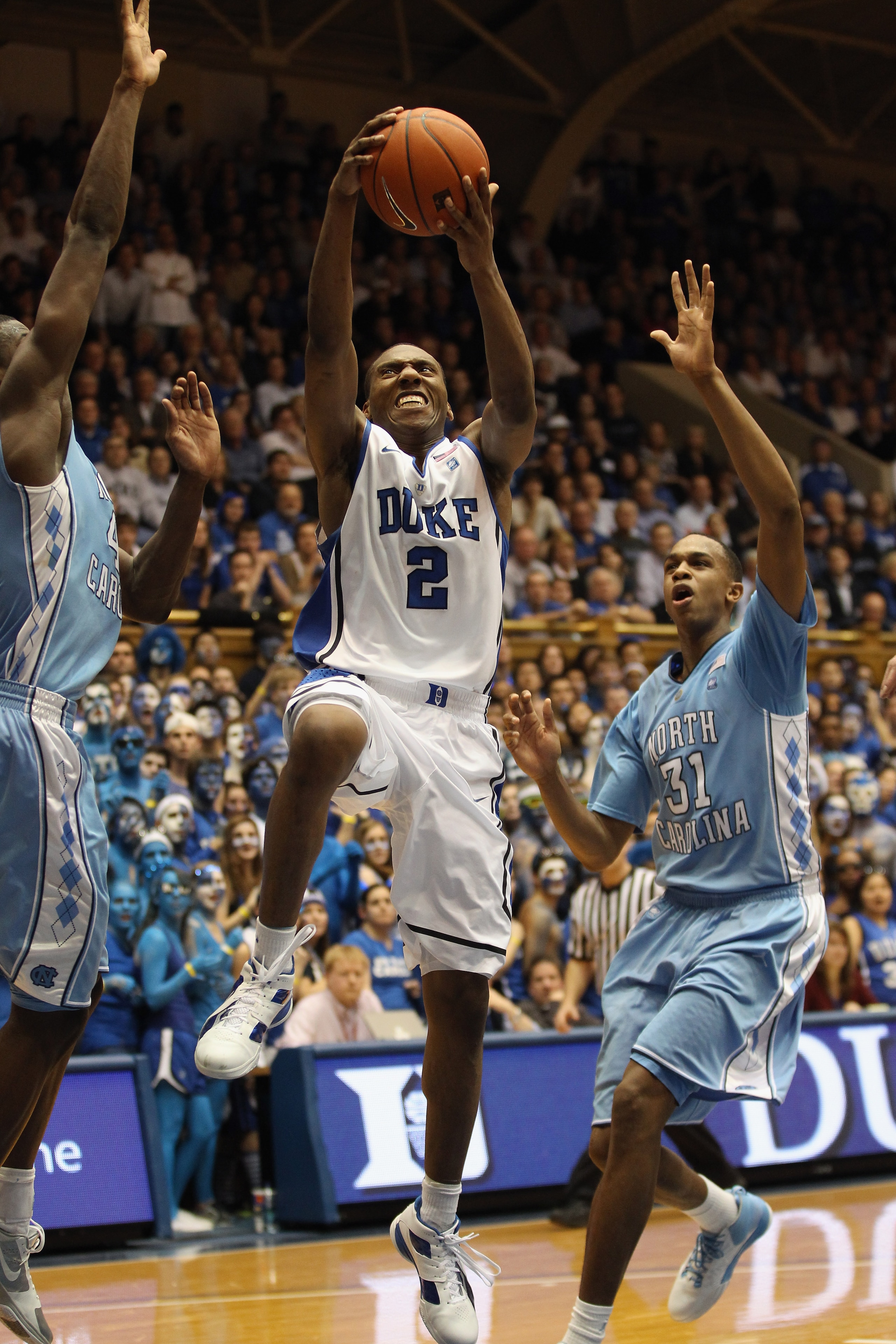 DURHAM, NC - FEBRUARY 09:  John Henson #31 of the North Carolina Tar Heels tries to stop Nolan Smith #2 of the Duke Blue Devils during their game at Cameron Indoor Stadium on February 9, 2011 in Durham, North Carolina.  (Photo by Streeter Lecka/Getty Imag