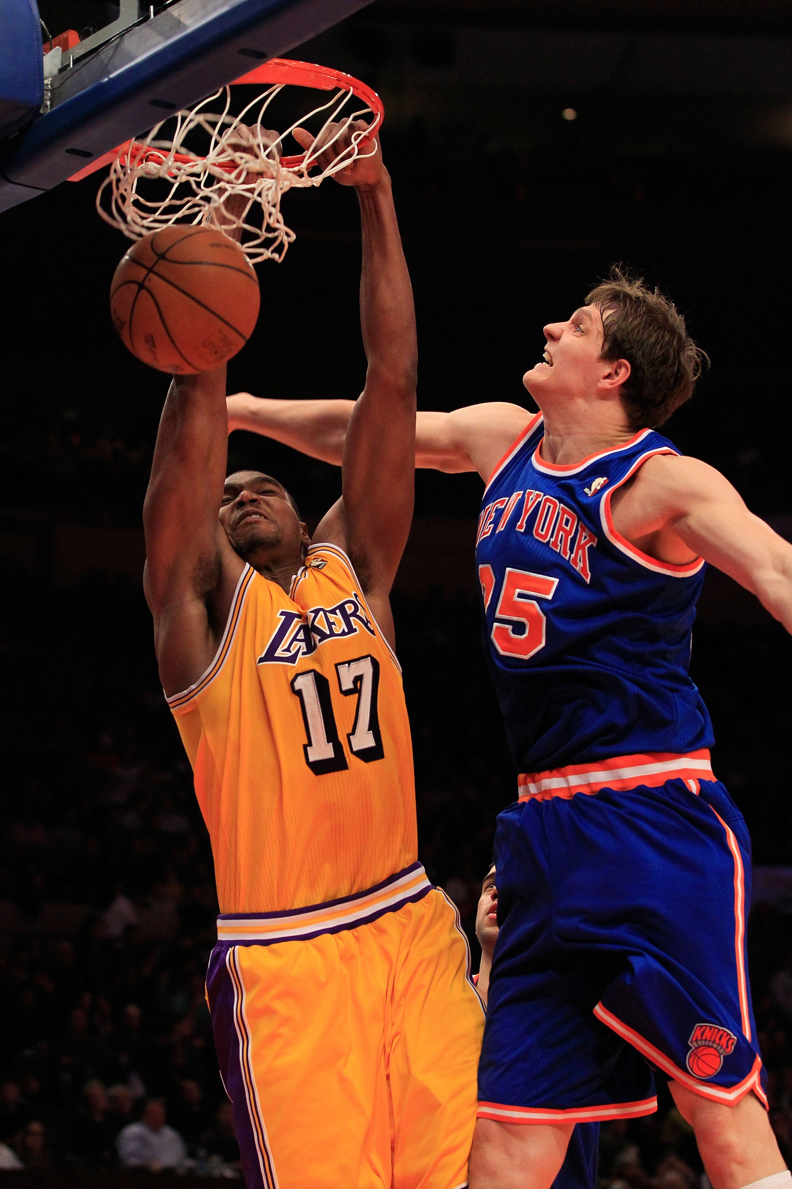 NEW YORK, NY - FEBRUARY 11: Andrew Bynum #17 of the Los Angeles Lakers shoots over Timofey Mozgov #25 of the New York Knicks at Madison Square Garden on February 11, 2011 in New York City. NOTE TO USER: User expressly acknowledges and agrees that, by down