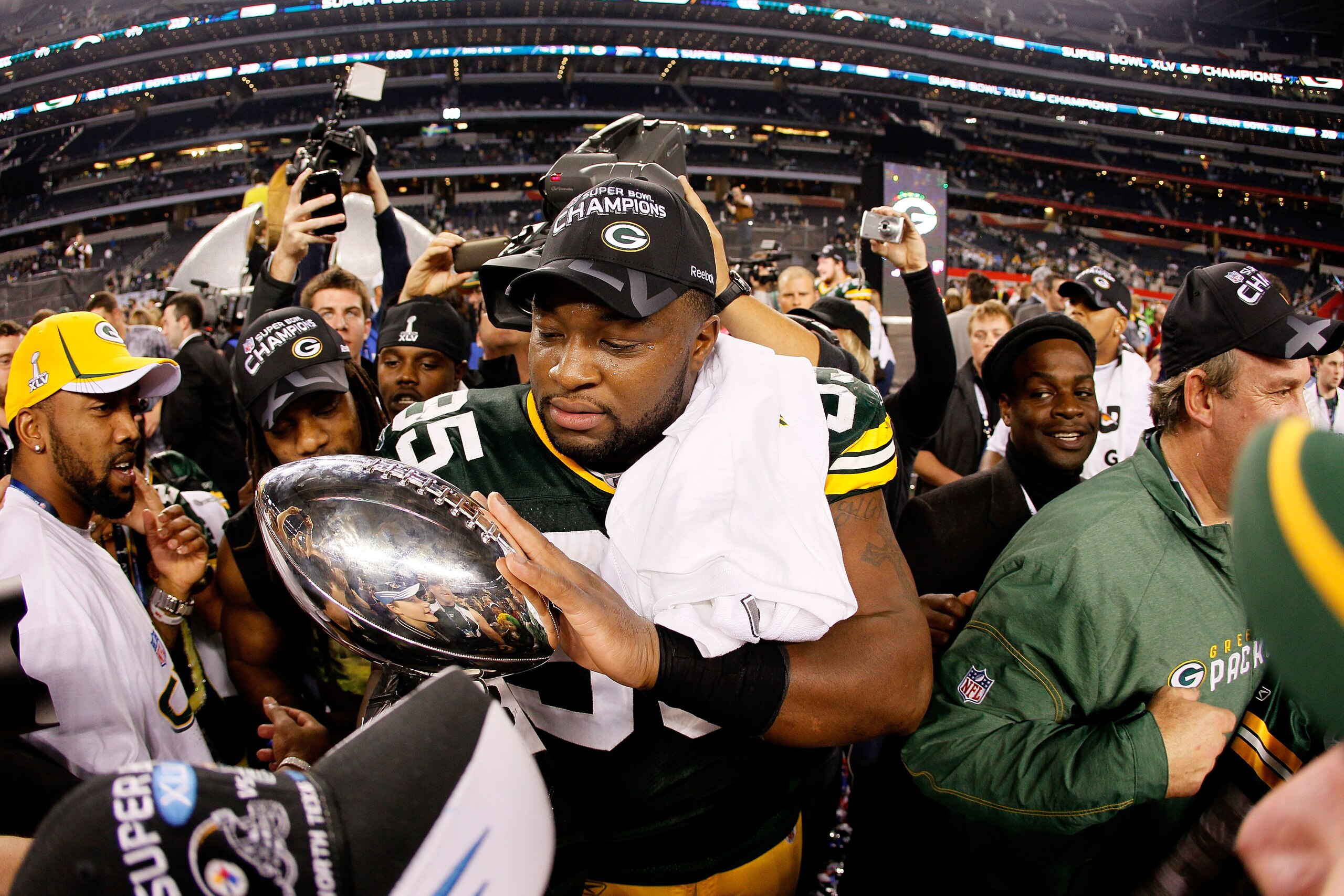 ARLINGTON, TX - FEBRUARY 06:  Howard Green #95 of the Green Bay Packers holds the Vince Lombardi trophy after the Packers won 31-25 against the Pittsburgh Steelers during Super Bowl XLV at Cowboys Stadium on February 6, 2011 in Arlington, Texas.  (Photo b