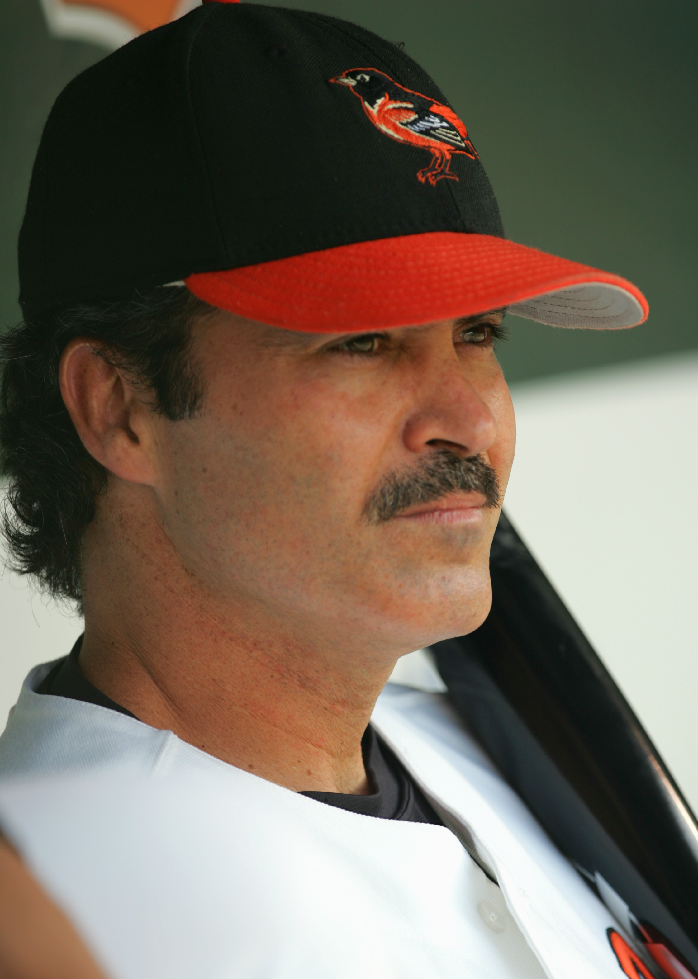 BALTIMORE, MD - AUGUST 29:  Rafael Palmeiro #25 of the Baltimore Orioles looks on from the dugout during the game against the Oakland Athletics on August 29, 2005 at Camden Yards in Baltimore, Maryland.  The A's won 10-5. (Photo By Jamie Squire/Getty Imag