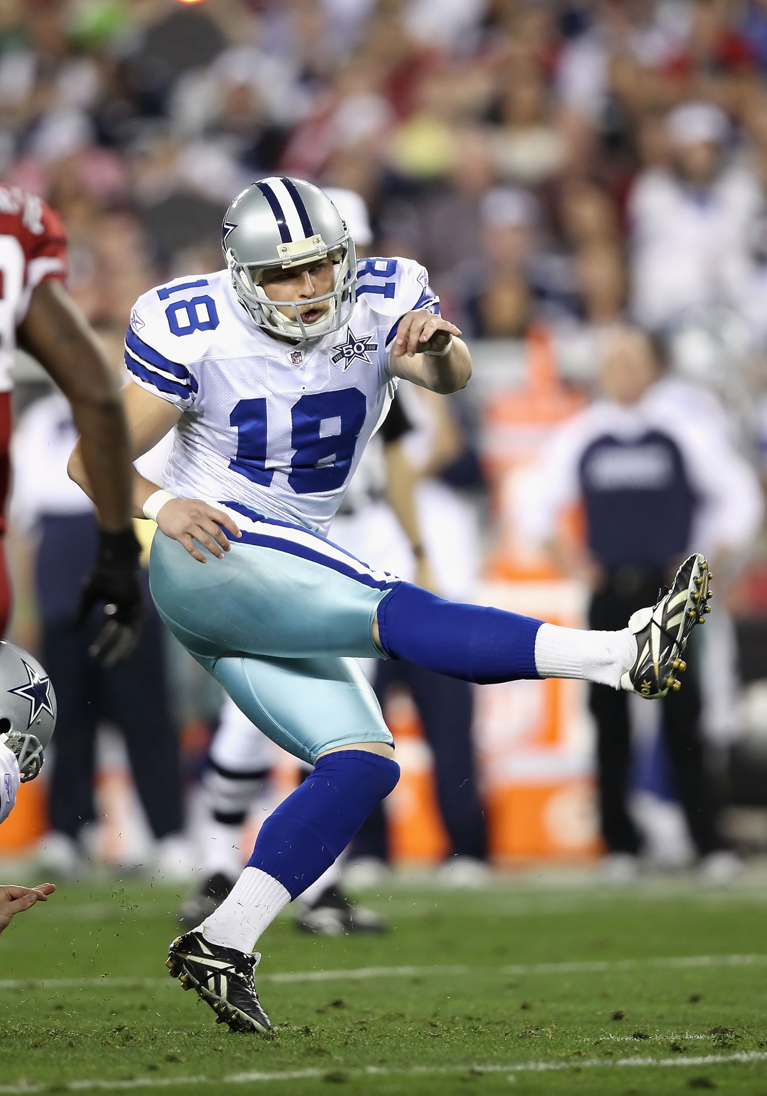 GLENDALE, AZ - DECEMBER 25:  Kicker David Buehler #18 of the Dallas Cowboys kicks a field goal during the NFL game against the Arizona Cardinals at the University of Phoenix Stadium on December 25, 2010 in Glendale, Arizona.  The Cardinals defeated the Co