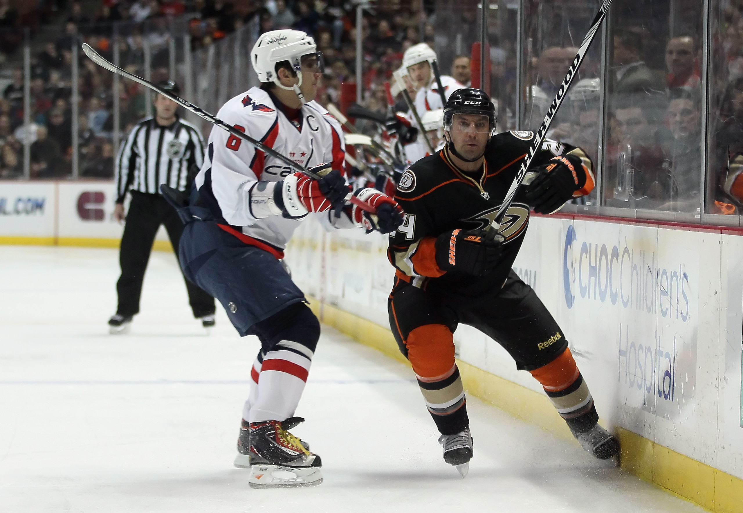 ANAHEIM, CA - FEBRUARY 16: Alex Ovechkin #8 of the Washington Capitals checks Francois Beauchemin #24 of the Anaheim Ducks into the boards in the first period at the Honda Center on February 16, 2011 in Anaheim, California. The Capitals defeated the Duck ANAHEIM, CA - FEBRUARY 16: Alex Ovechkin #8 of the Washington Capitals checks Francois Beauchemin #24 of the Anaheim Ducks into the boards in the first period at the Honda Center on February 16, 2011 in Anaheim, California. The Capitals defeated the Duck