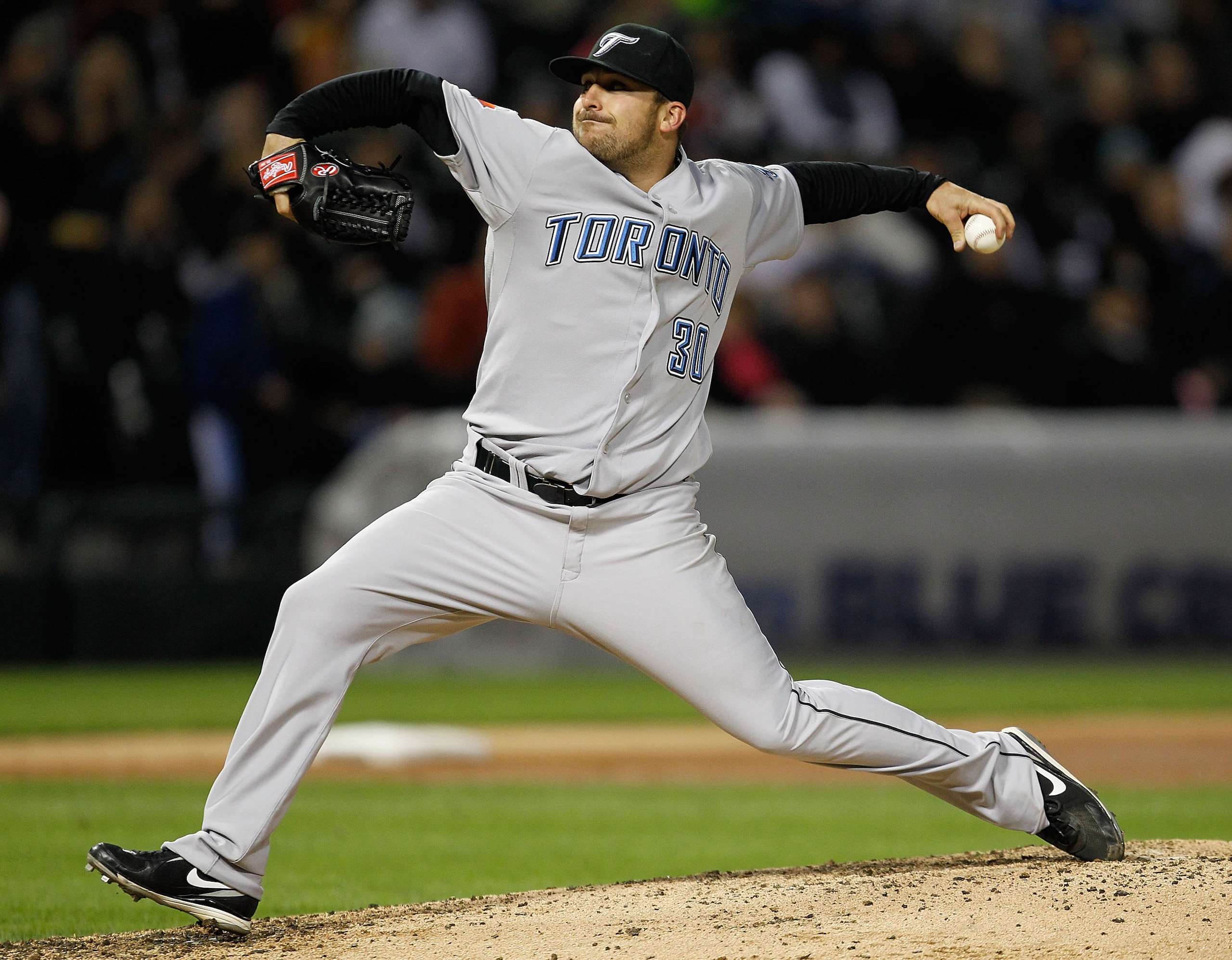 CHICAGO - MAY 06: Starting pitcher Dana Eveland #30 of the Toronto Blue Jays delivers the ball against the Chicago White Sox at U.S. Cellular Field on May 6, 2010 in Chicago, Illinois. (Photo by Jonathan Daniel/Getty Images) CHICAGO - MAY 06: Starting pitcher Dana Eveland #30 of the Toronto Blue Jays delivers the ball against the Chicago White Sox at U.S. Cellular Field on May 6, 2010 in Chicago, Illinois. (Photo by Jonathan Daniel/Getty Images)