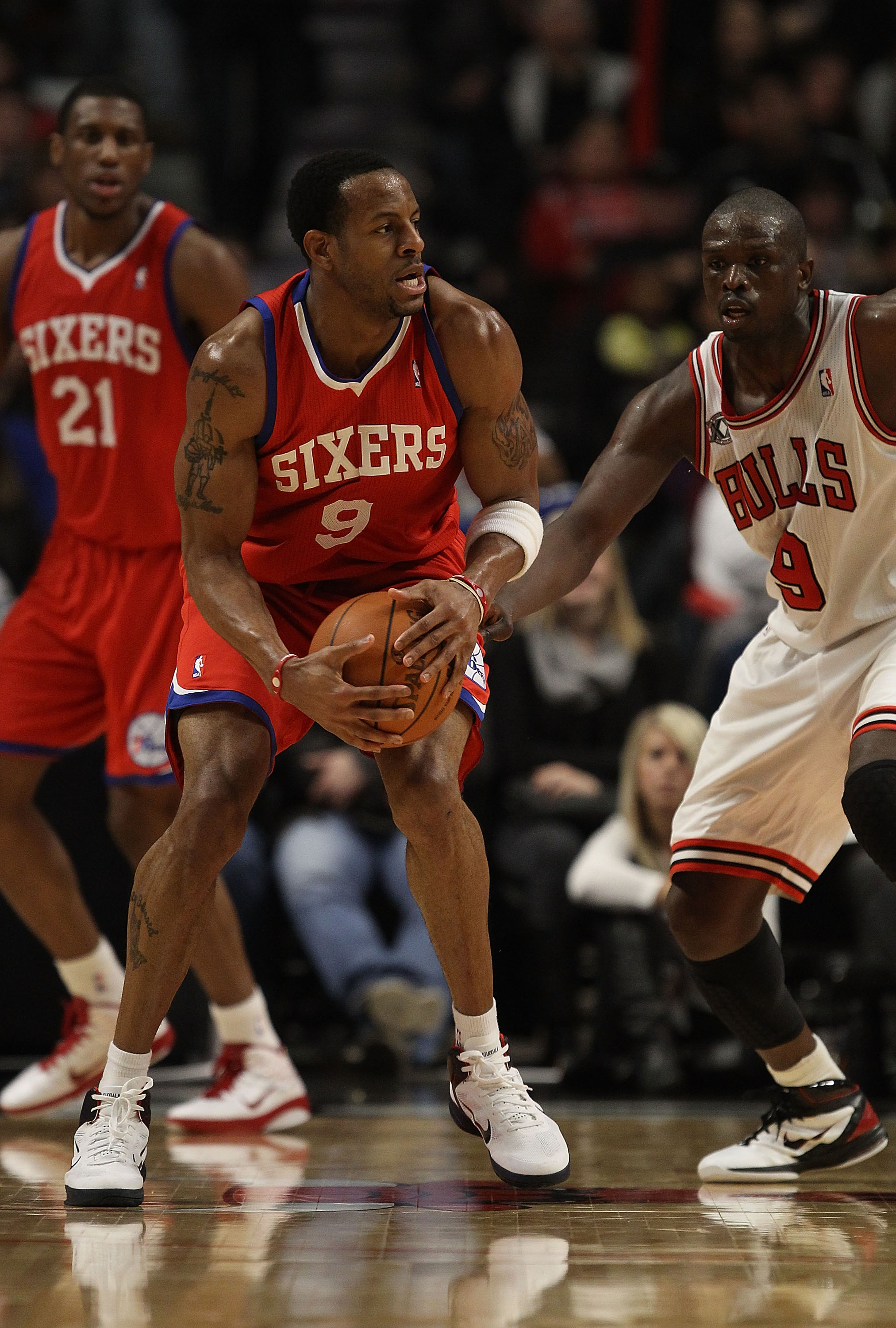 CHICAGO, IL - DECEMBER 21: Andre Iguodala #9 of the Philadelphia 76ers tries to move against Loul Deng #9 of the Chicago Bulls at the United Center on December 21, 2010 in Chicago, Illinois. The Bulls defeated the 76ers 121-76. NOTE TO USER: User expressl