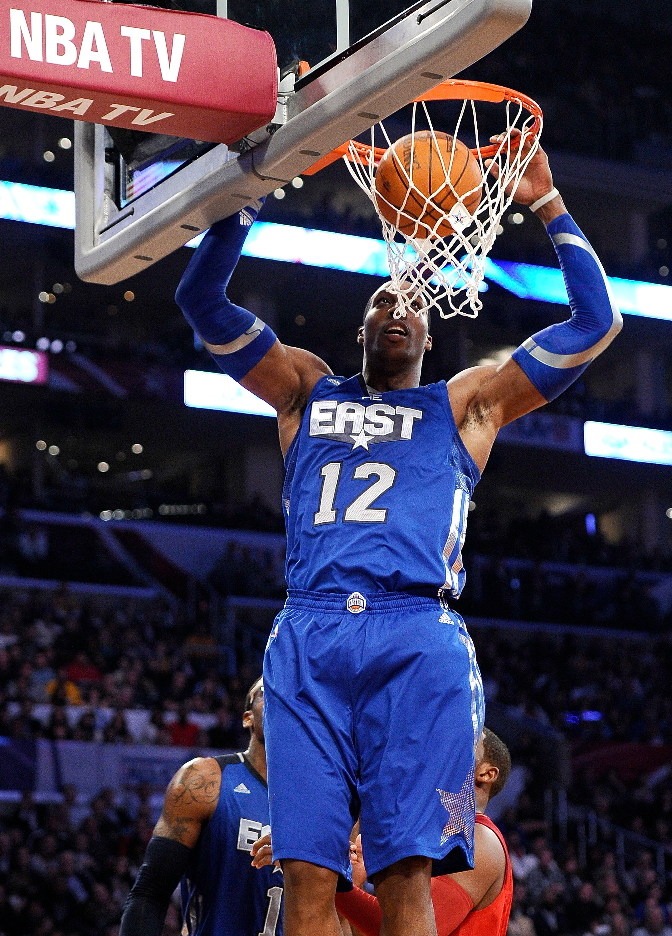 LOS ANGELES, CA - FEBRUARY 20: Dwight Howard #12 of the Orlando Magic and the Eastern Conference dunks the ball in the 2011 NBA All-Star Game at Staples Center on February 20, 2011 in Los Angeles, California. NOTE TO USER: User expressly acknowledges and