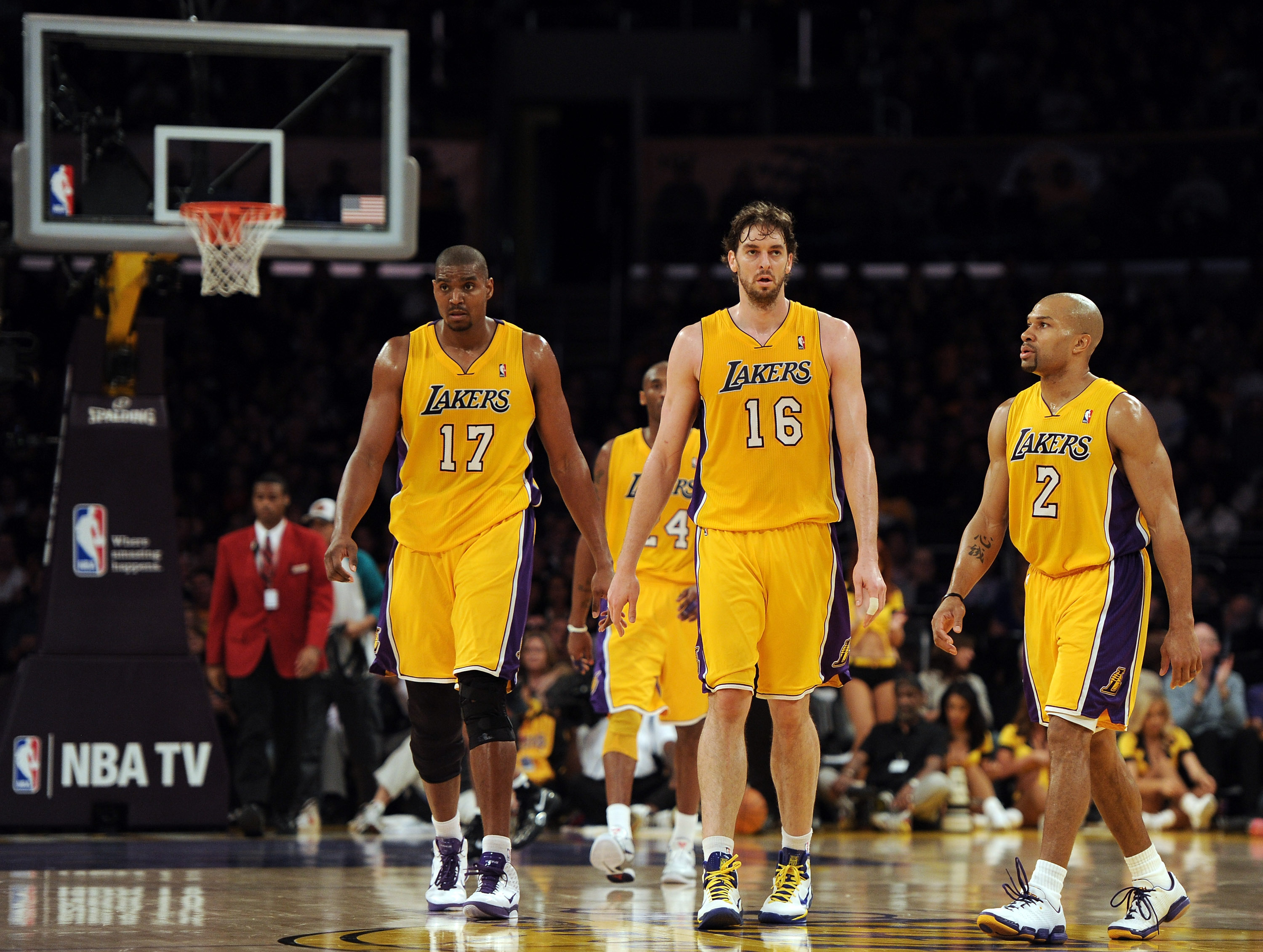 LOS ANGELES, CA - FEBRUARY 03: Pau Gasol #16, Derek Fisher #2 and Andrew Bynum #17 of the Los Angeles Lakers leave the court for a timeout trailing the San Antonio Spurs at Staples Center on February 3, 2011 in Los Angeles, California.  NOTE TO USER: User