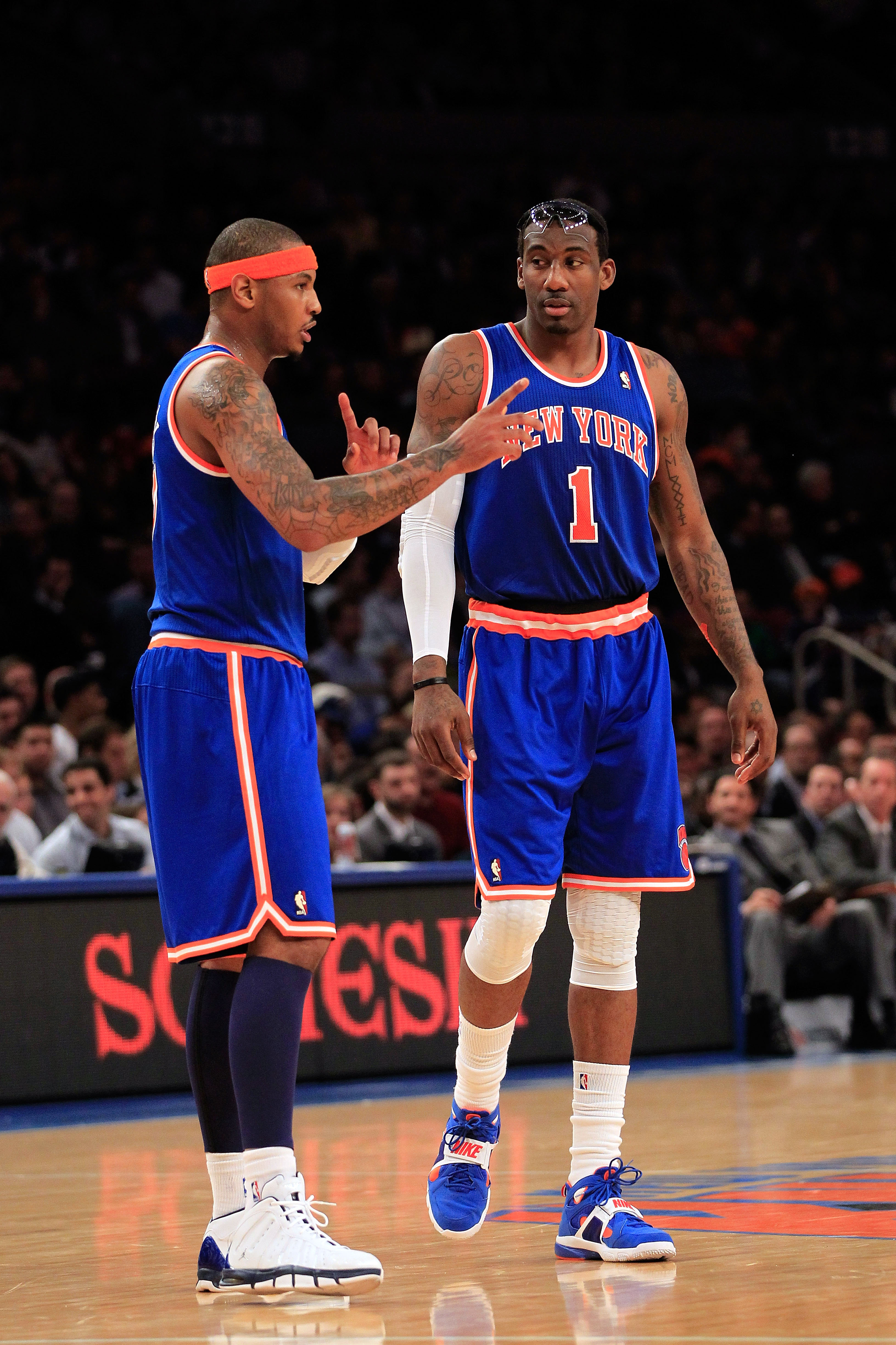 NEW YORK, NY - FEBRUARY 23: (L-R) Carmelo Anthony #7 and Amar'e Stoudemire #1 of the New York Knicks discuss tactics on the court against the Milwaukee Bucks at Madison Square Garden on February 23, 2011 in New York City. NOTE TO USER: User expressly ackn